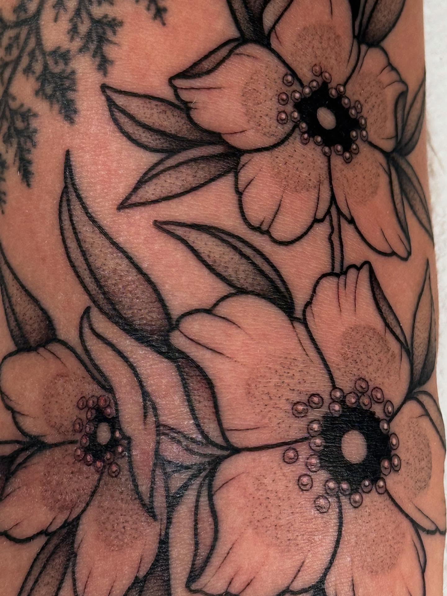 Flowers dotwork tattoo on the forearm by Erin Shea