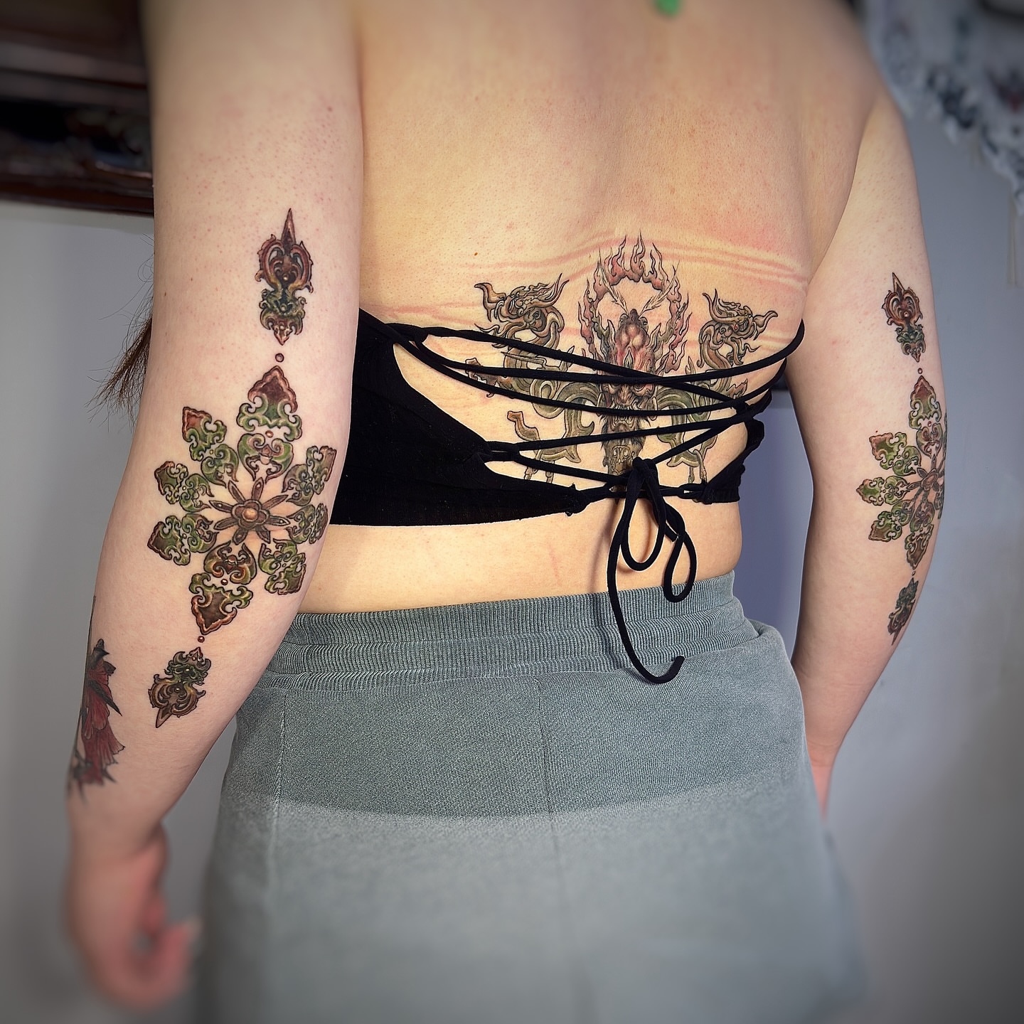 Floral mandala geometric tattoo on the back by Jemin Ren