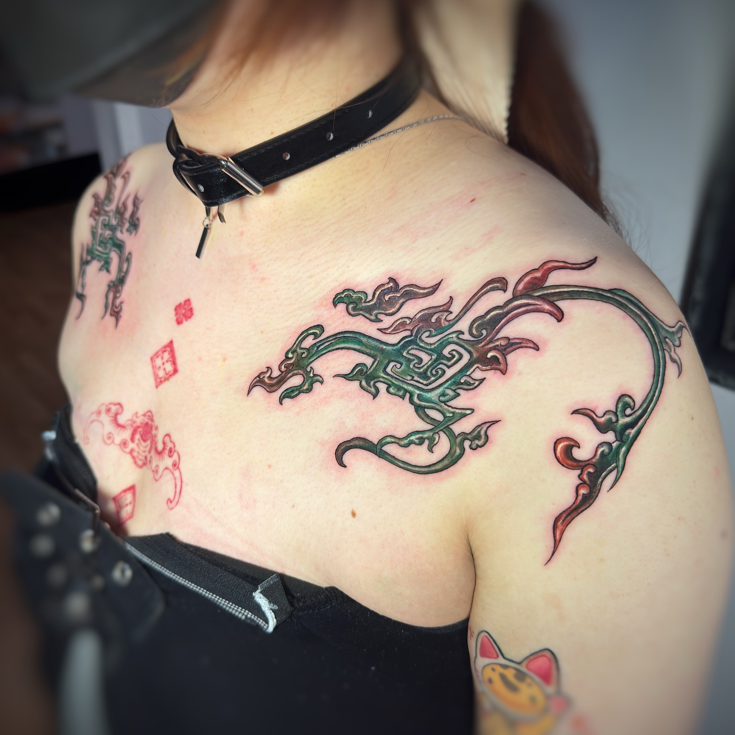 Serpent tribal tattoo on the shoulder by Jemin Ren
