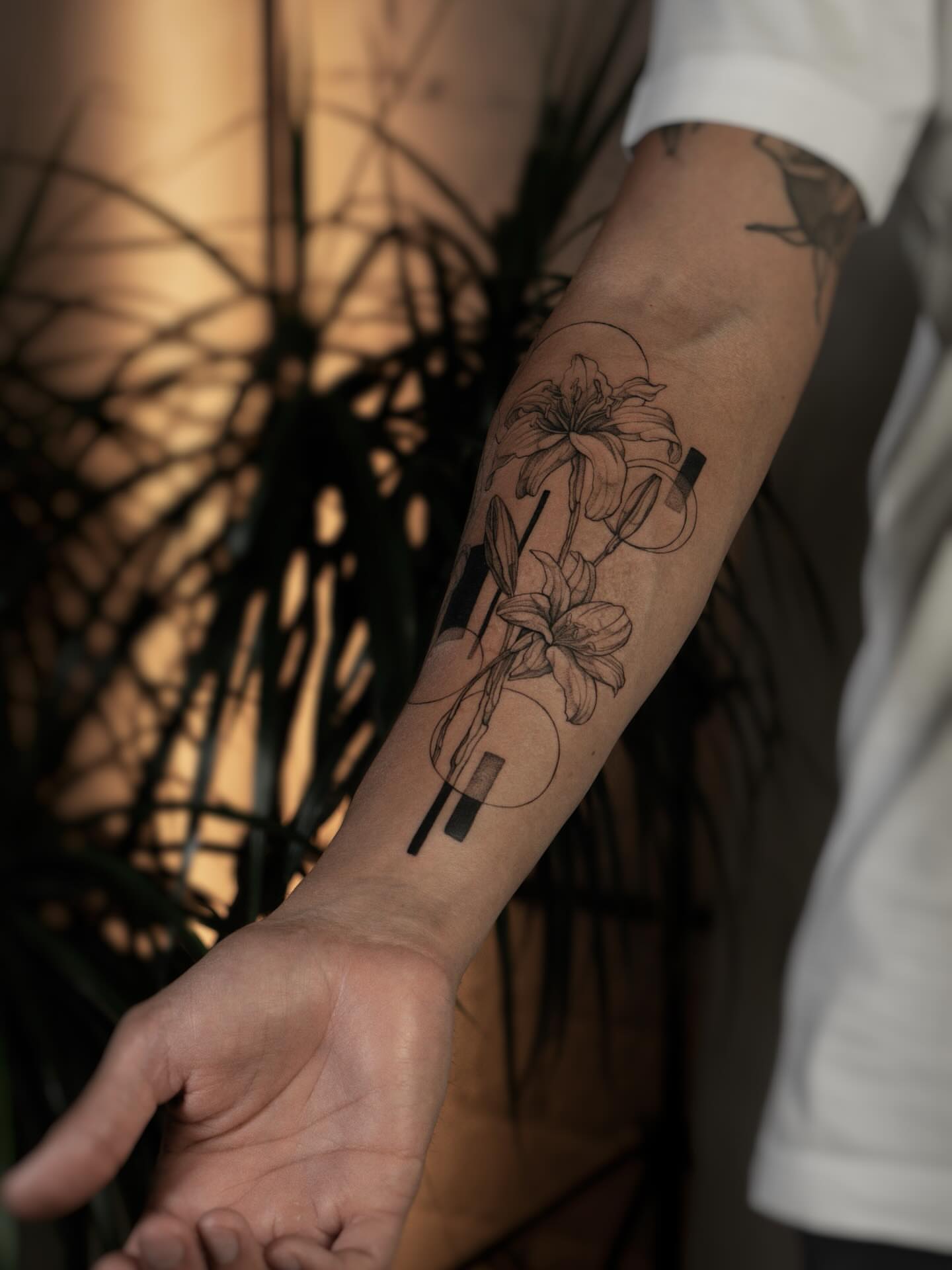 Lilies minimalist tattoo on the forearm by ᴛᴀᴛᴛᴏᴏ ᴀʀᴛɪꜱᴛ 📍Portland, OR