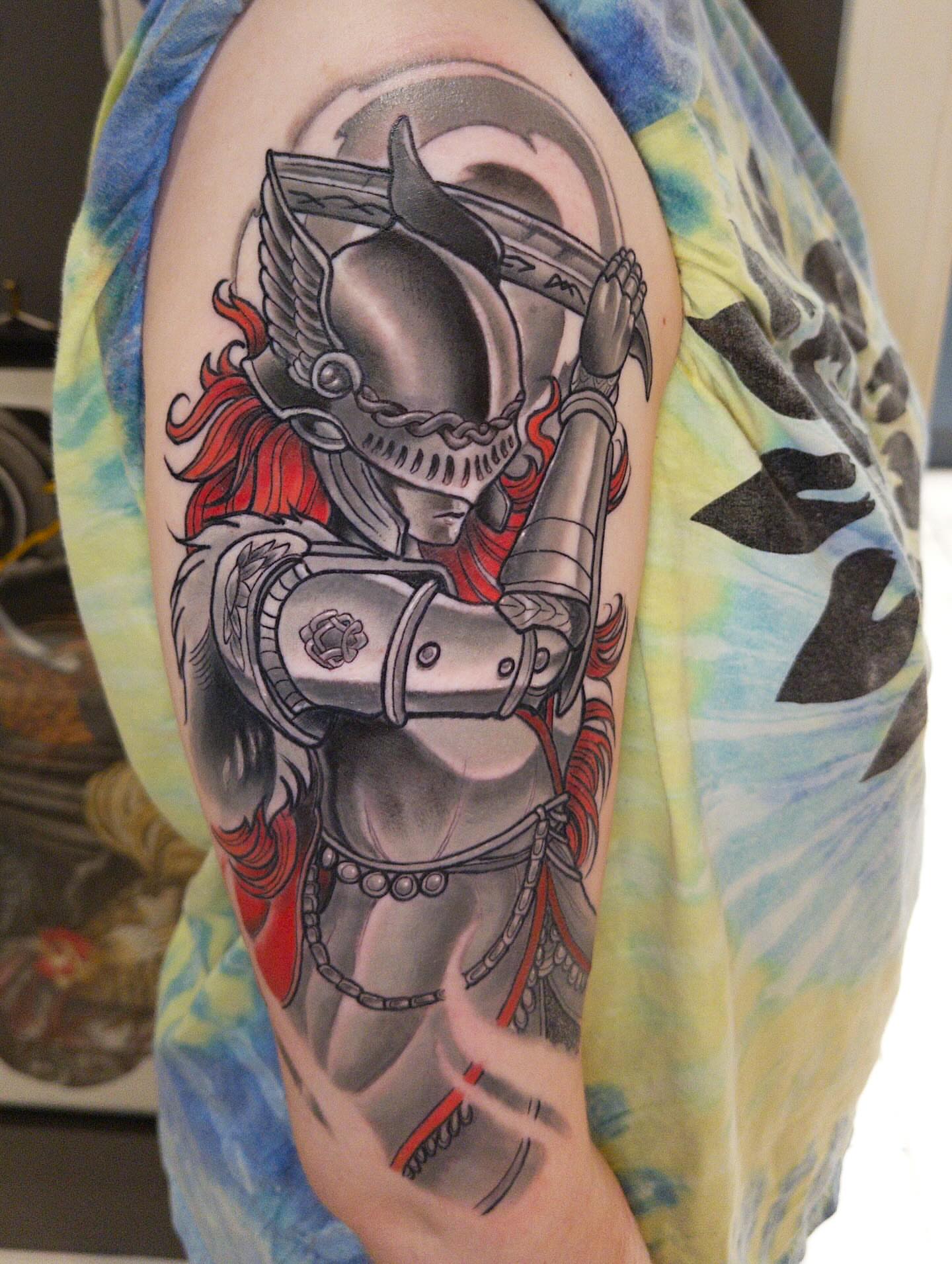 Knight realism tattoo on the upper arm by John Milosh Chamberlin