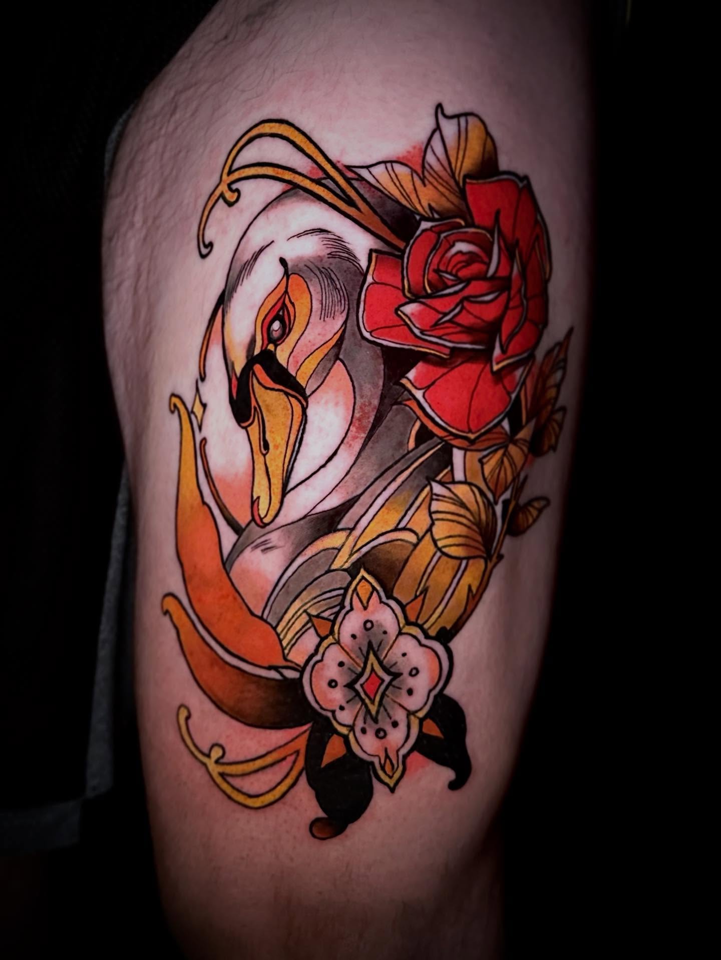 Swan and rose American traditional tattoo on the thigh by Justin Giacobbi
