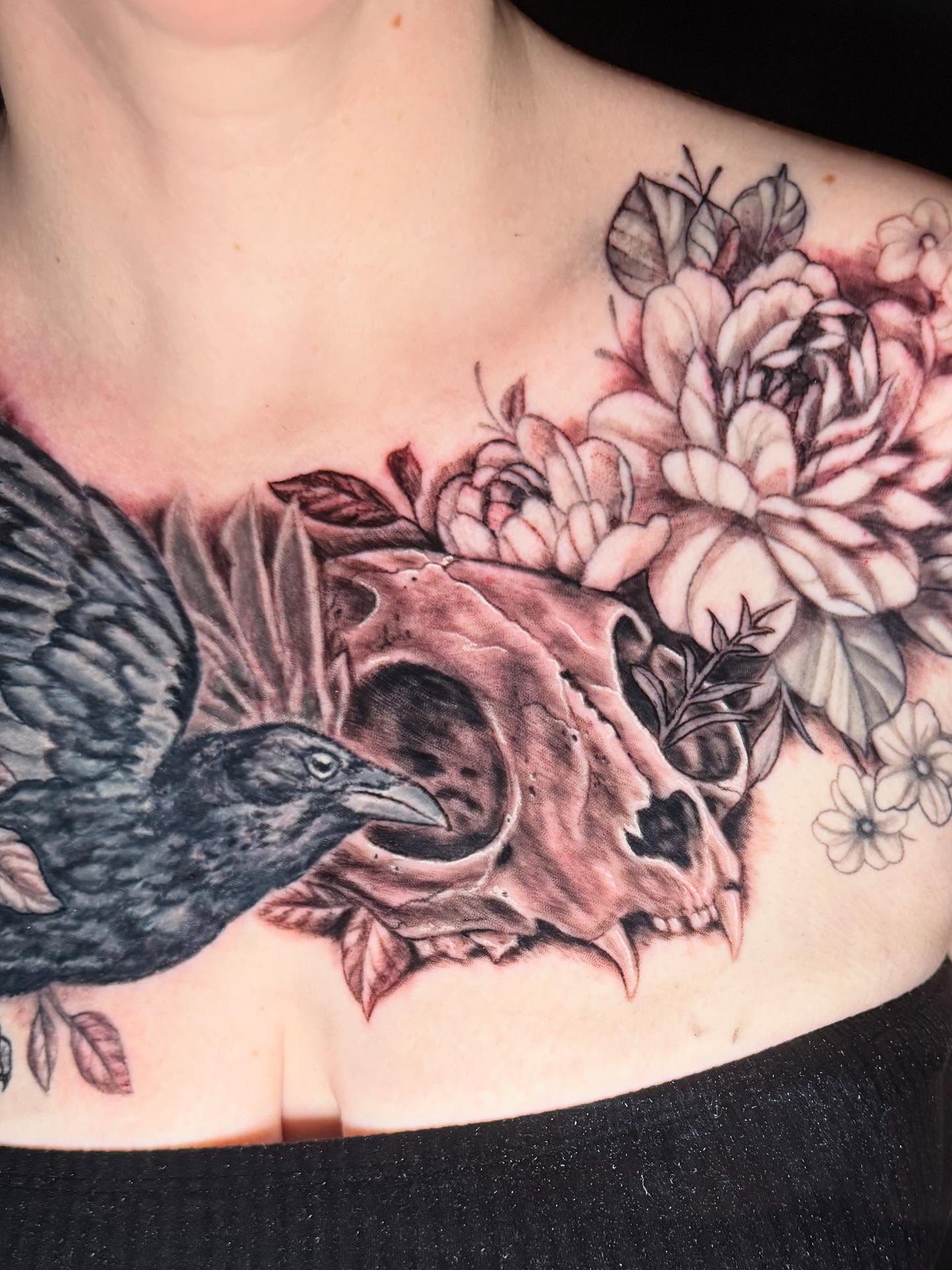 Skull and flowers realism tattoo on the chest by Patrick Cornolo