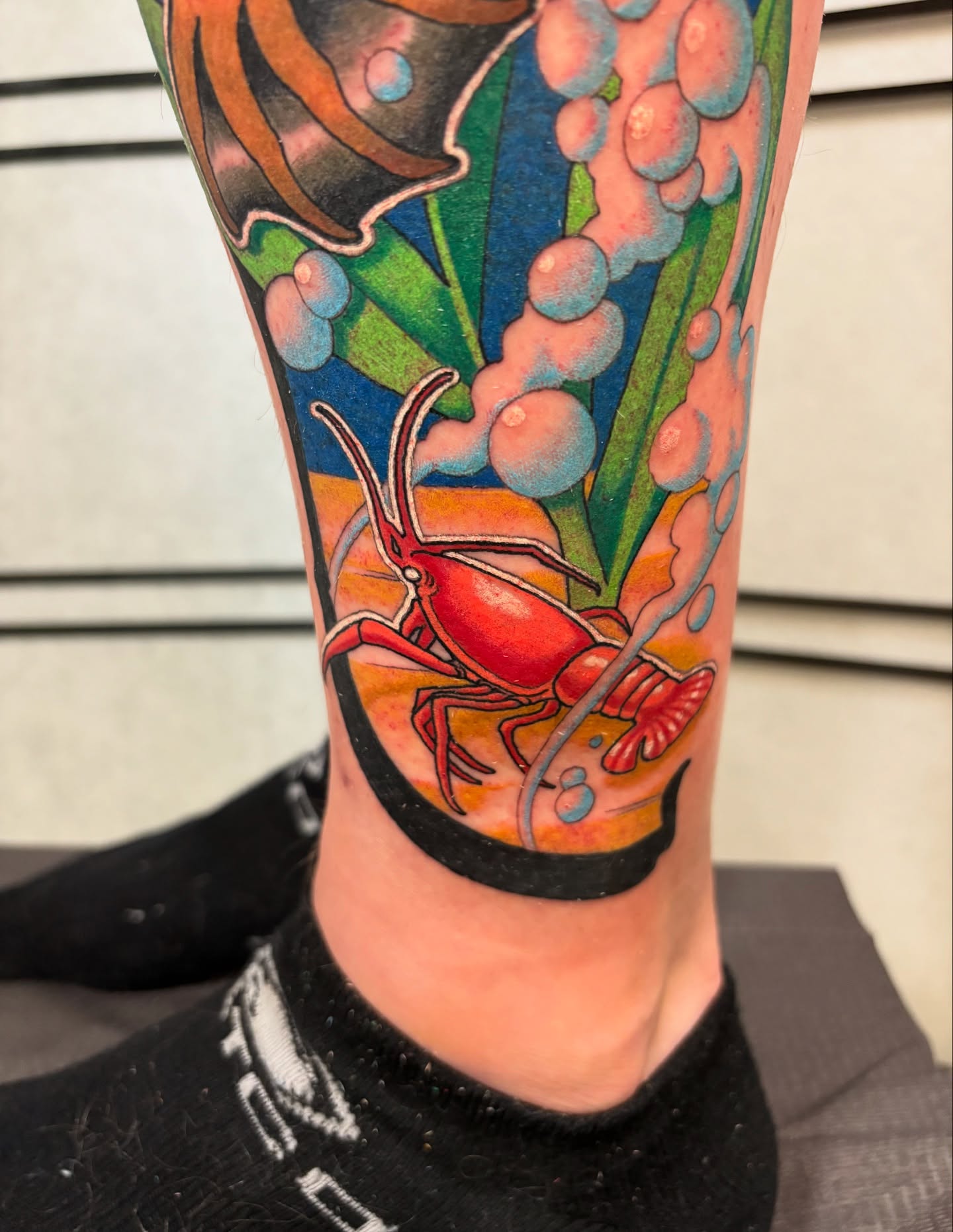 Crab and seaweed realism tattoo on the calf by Seattle Tattoo Artist, Bonney Lake, Washington