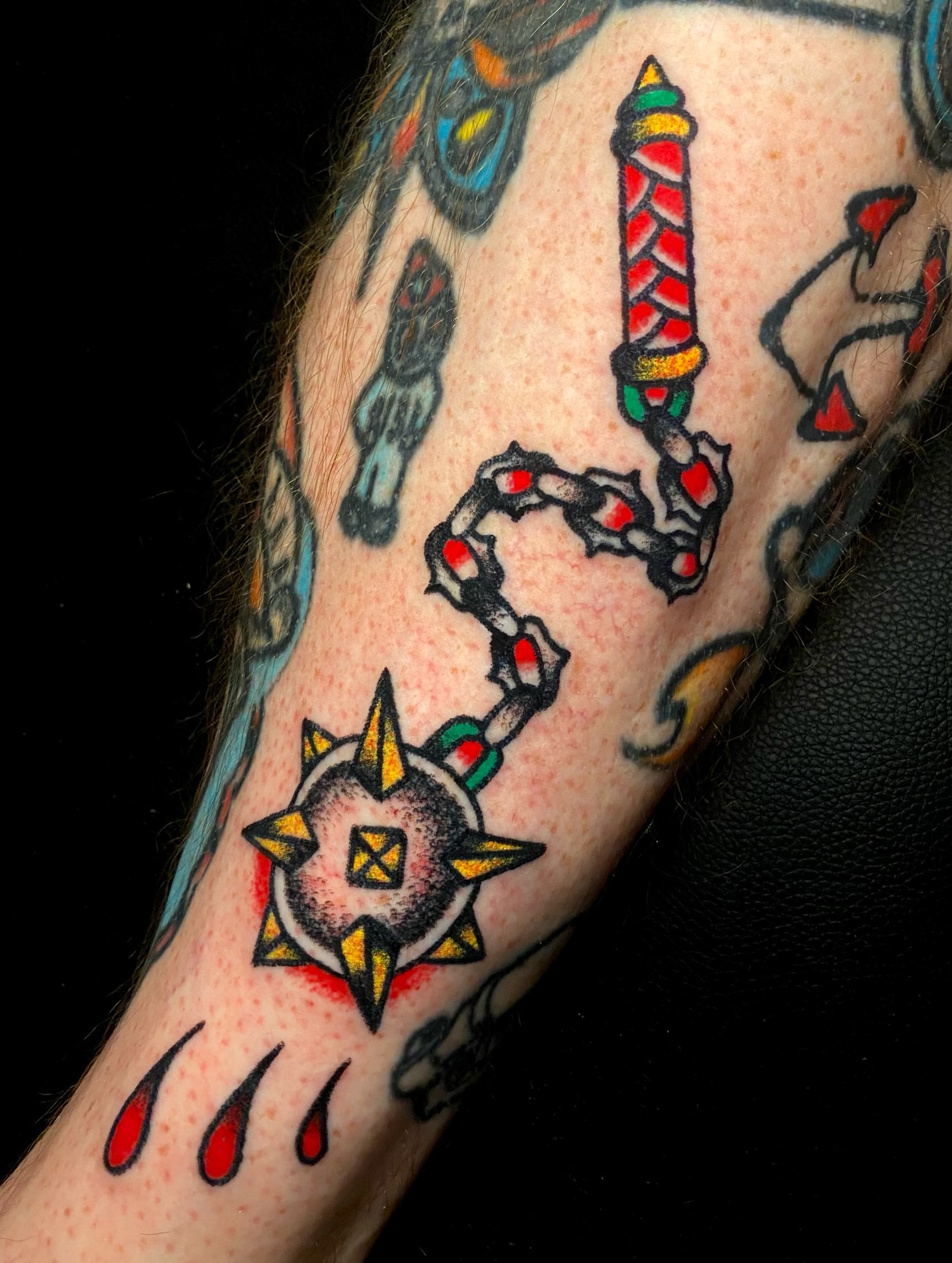 Sword and candle American traditional tattoo on the forearm by Daniel Diego