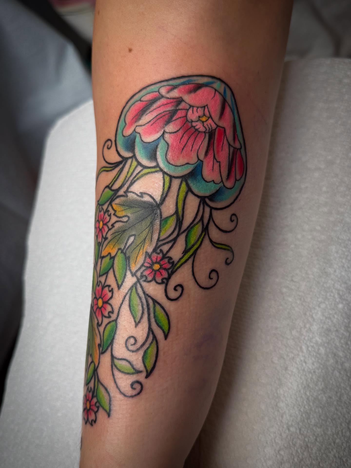 Floral vine American traditional tattoo on the forearm by Michelle