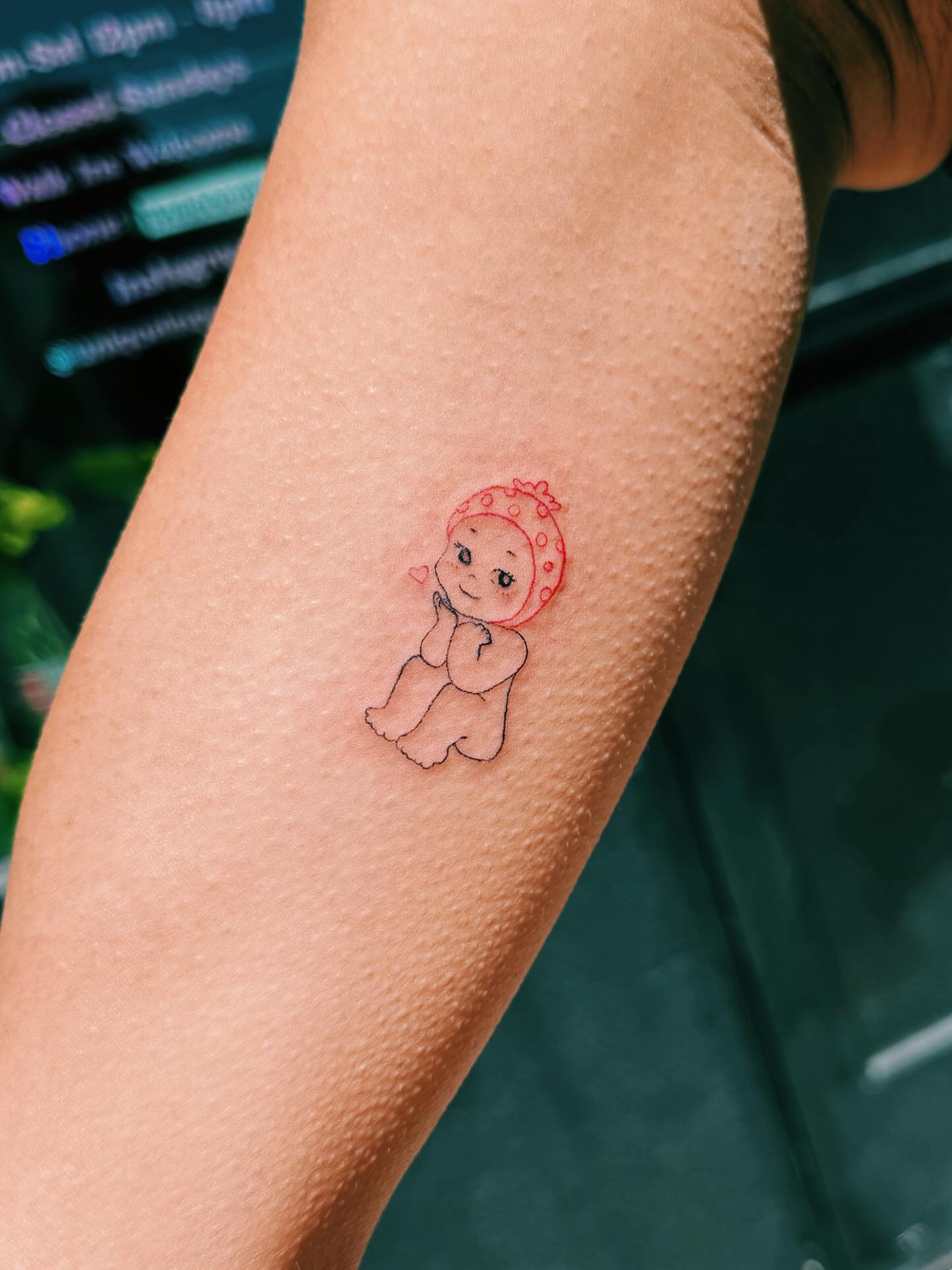 Baby illustrative tattoo on the forearm by Paulina Vazquez