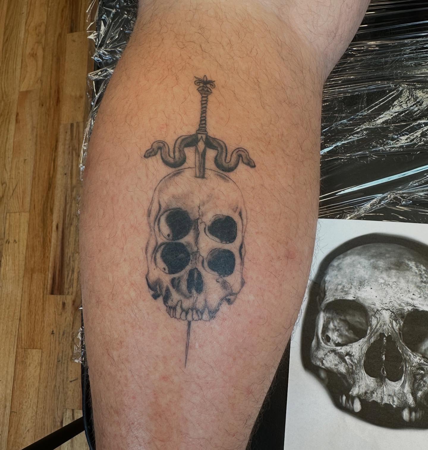 Skull with sword realism tattoo on the forearm by Marie Novotny, Lakewood, Ohio