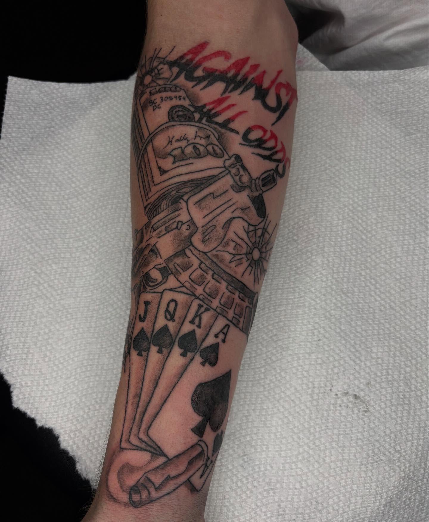 Cards and robot American traditional tattoo on the forearm by Evan Chastain