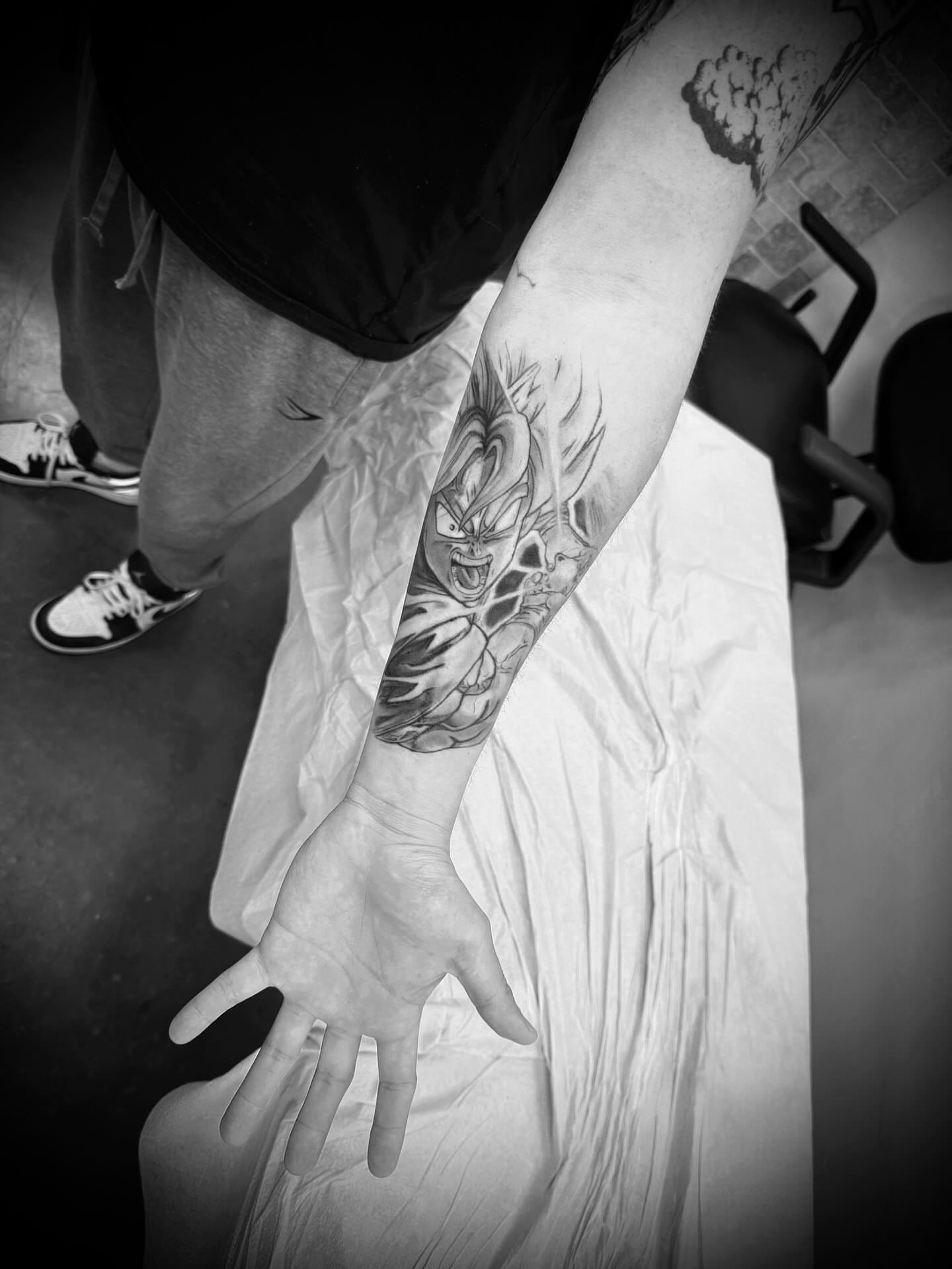 Dragon ball character anime tattoo on the forearm by Julian Olson