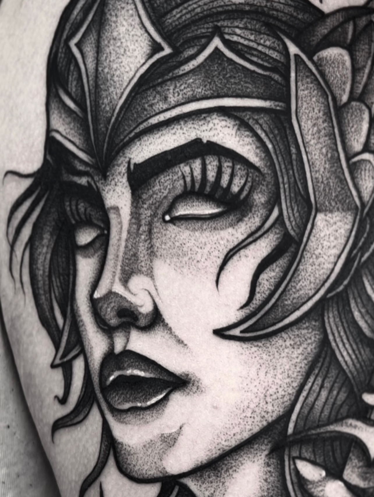 Woman's face dotwork tattoo on the forearm by Jared🗡Hughes