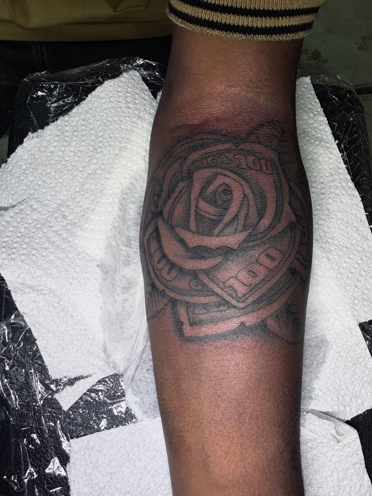 Rose black and grey tattoo on the forearm by Maleek Inkz