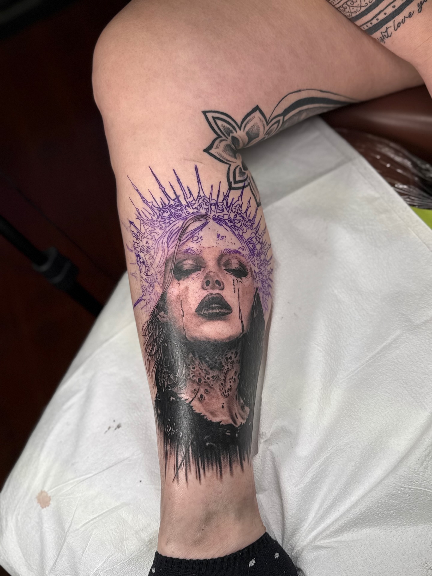 Woman with crown realism tattoo on the forearm by James Reed Tattoo artist