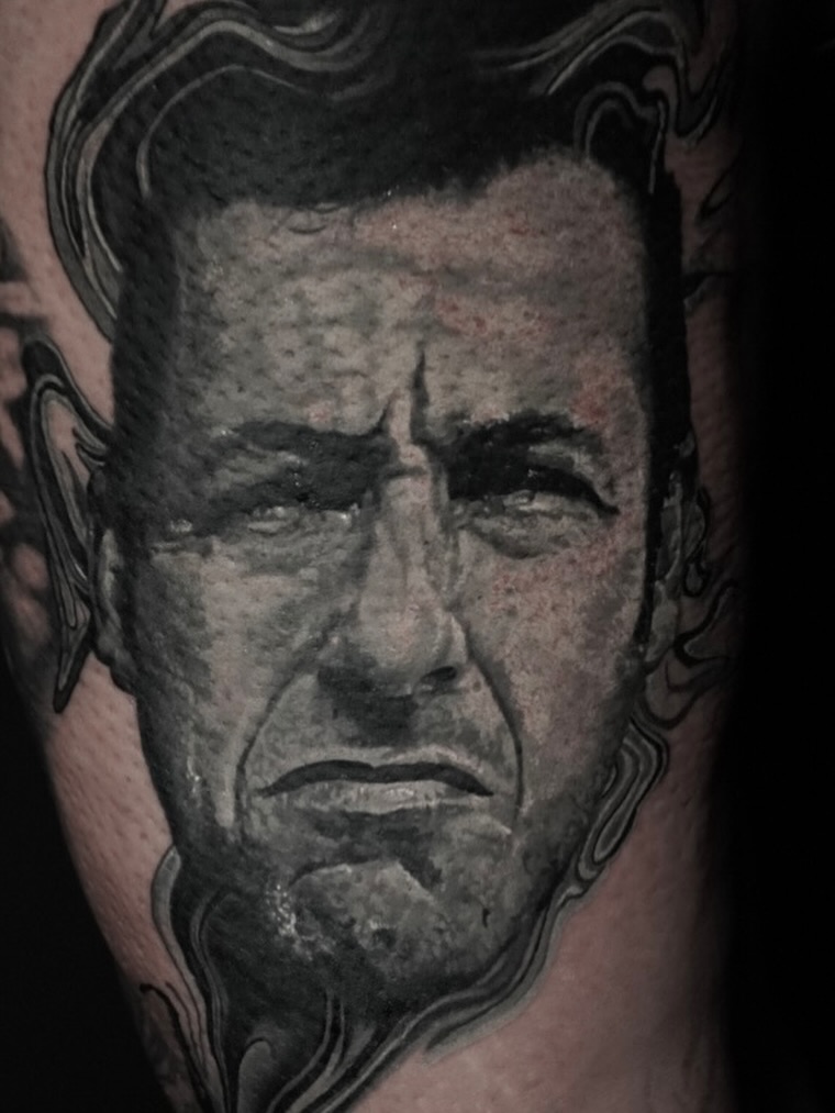 Portrait realism tattoo on the forearm by Justin Shelpman