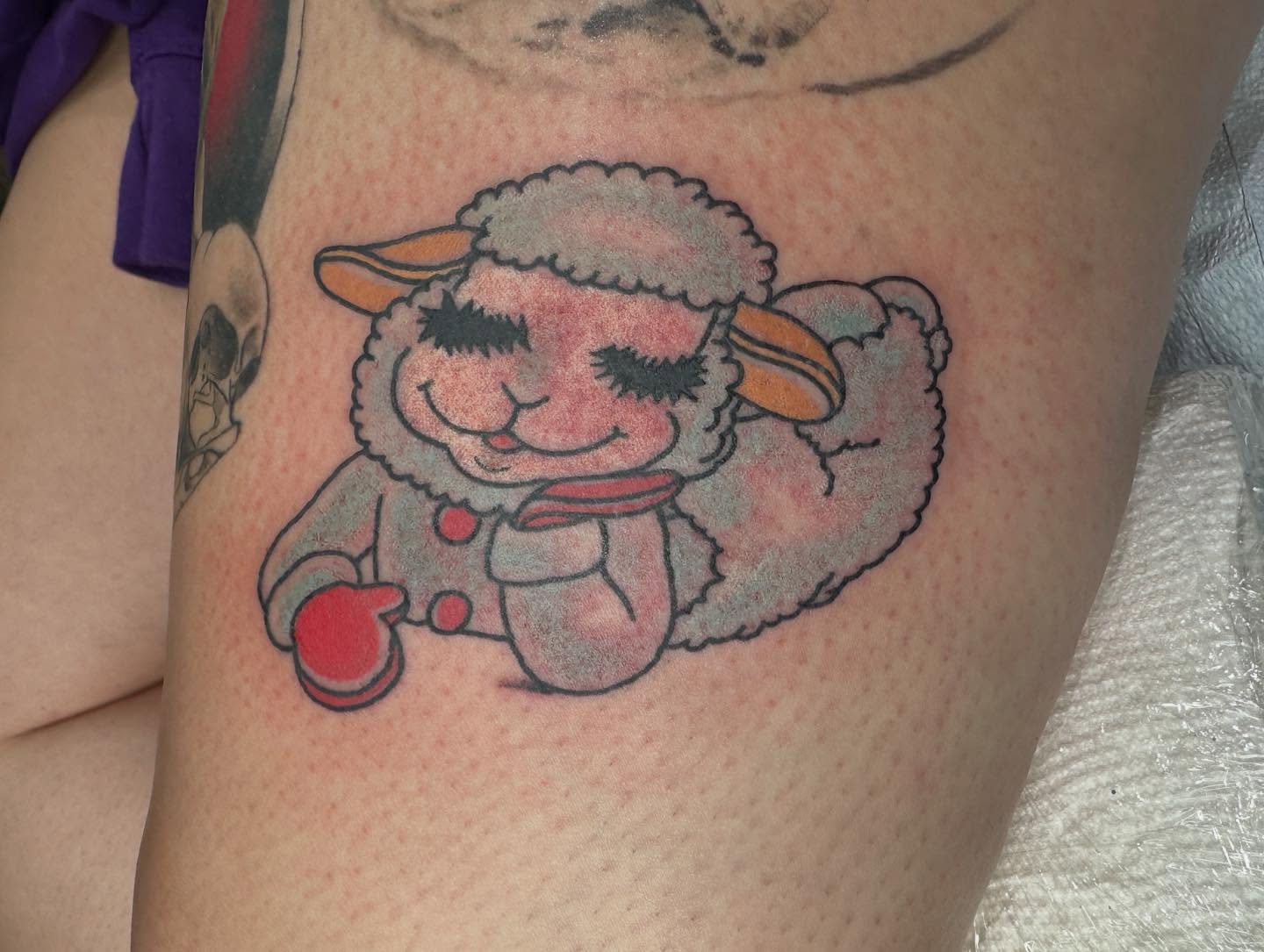 Sheep new school tattoo on the thigh by Andrea Lynne Hastings-Craven Tattoo Artist, Cleveland, Ohio