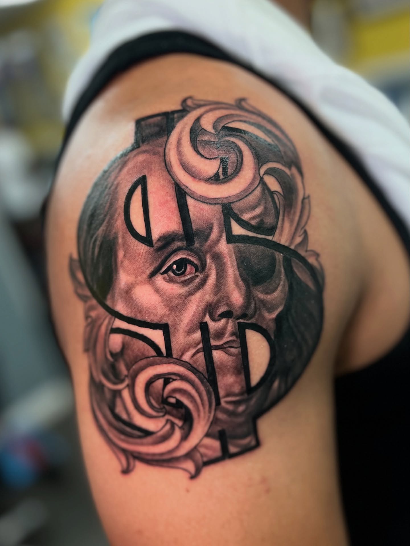 Portrait realism tattoo on the shoulder by Vondrae