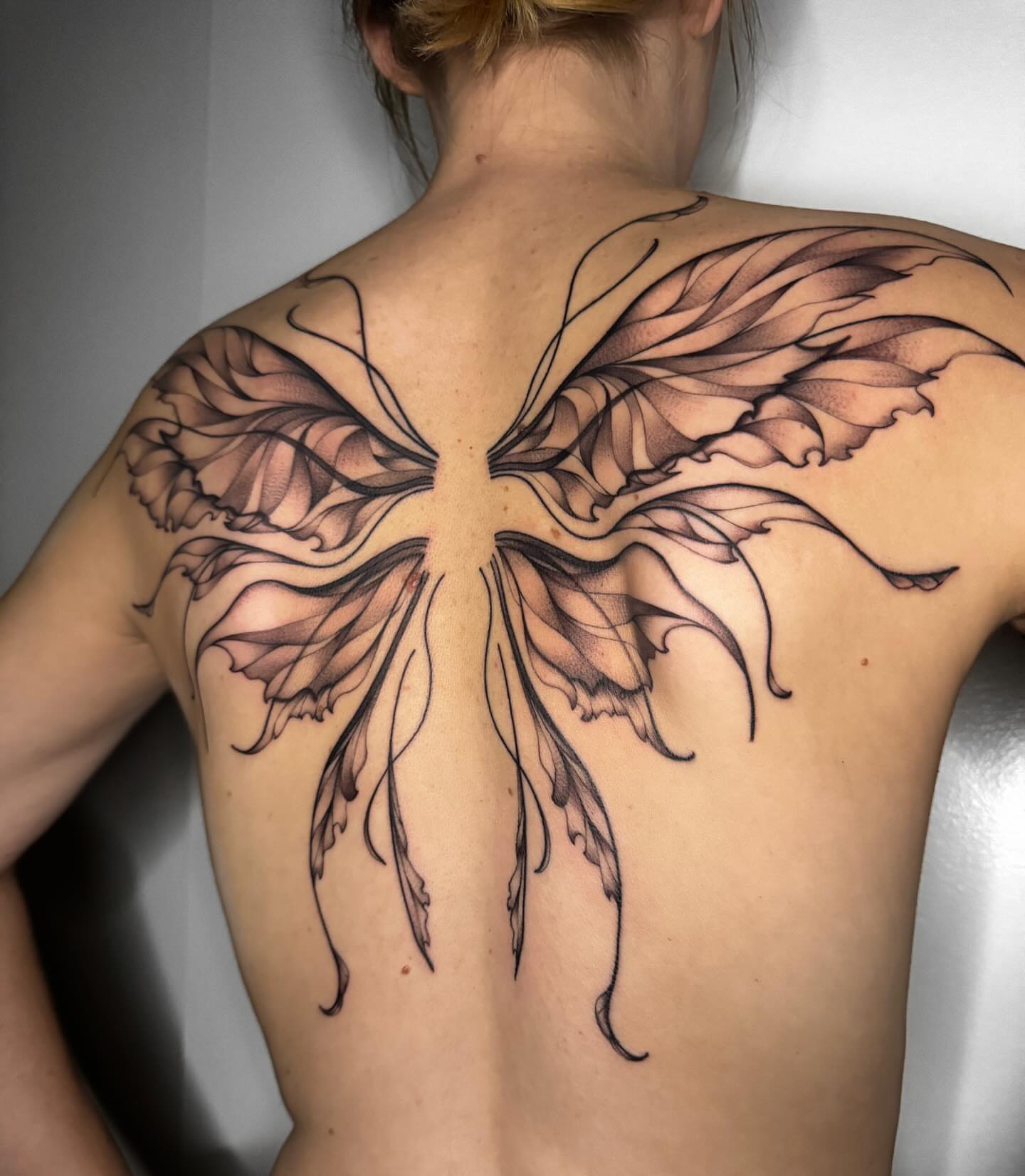 Wings black and grey tattoo on the back by Austin Tattoo Artist, Austin, Texas