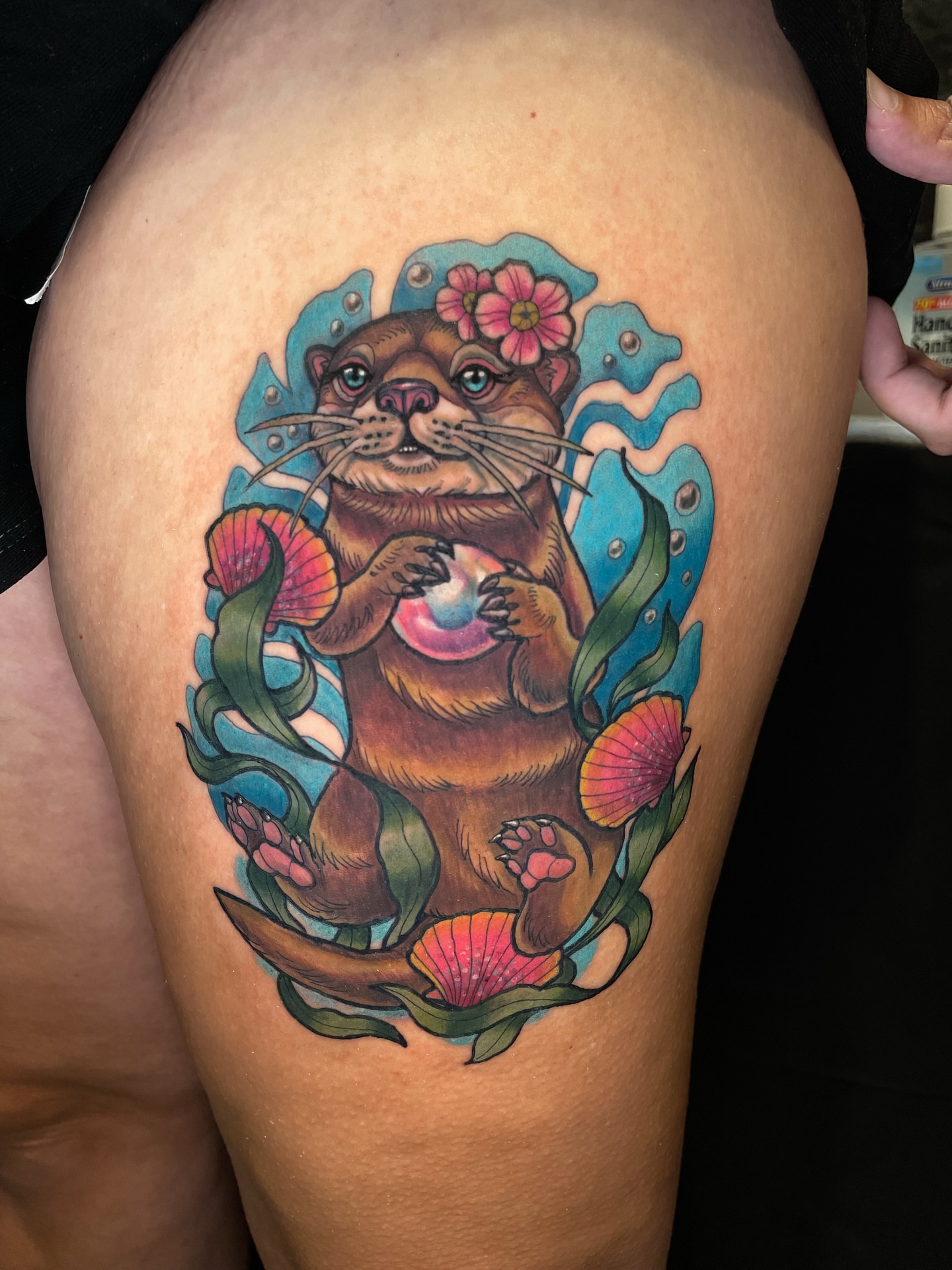 Otter new school tattoo on the thigh by Rick Elliott