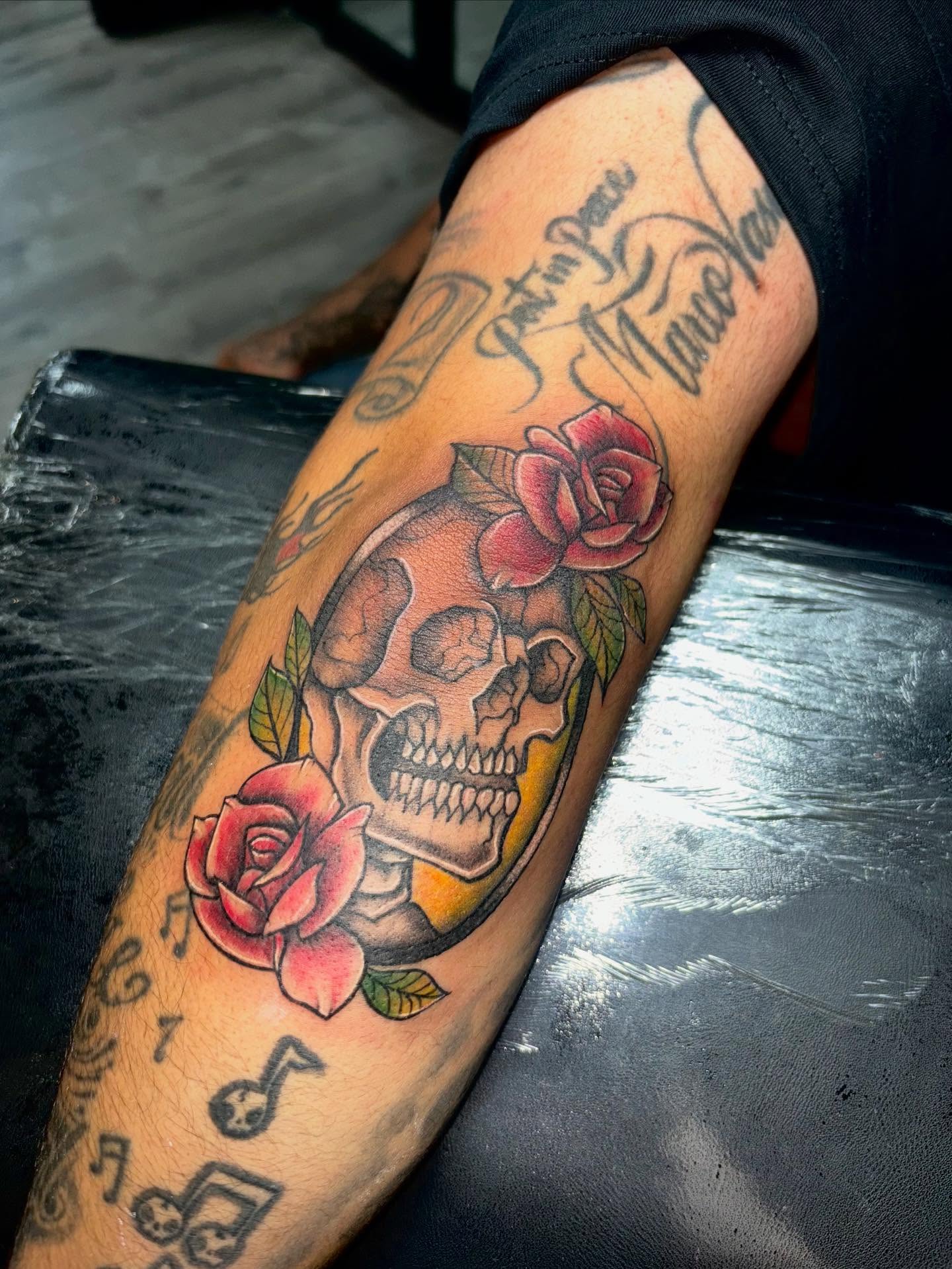 Skull and roses American traditional tattoo on the forearm by ππππππ