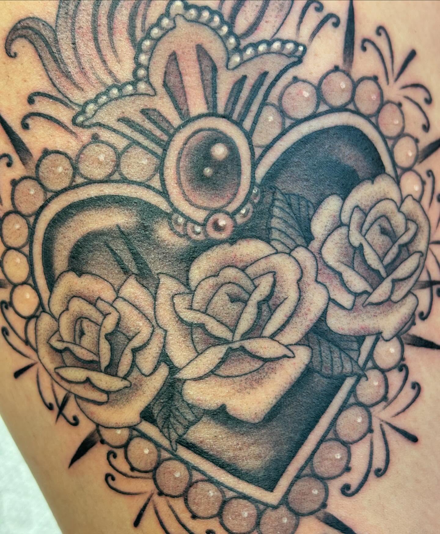 Roses and heart American traditional tattoo on the forearm by Storm