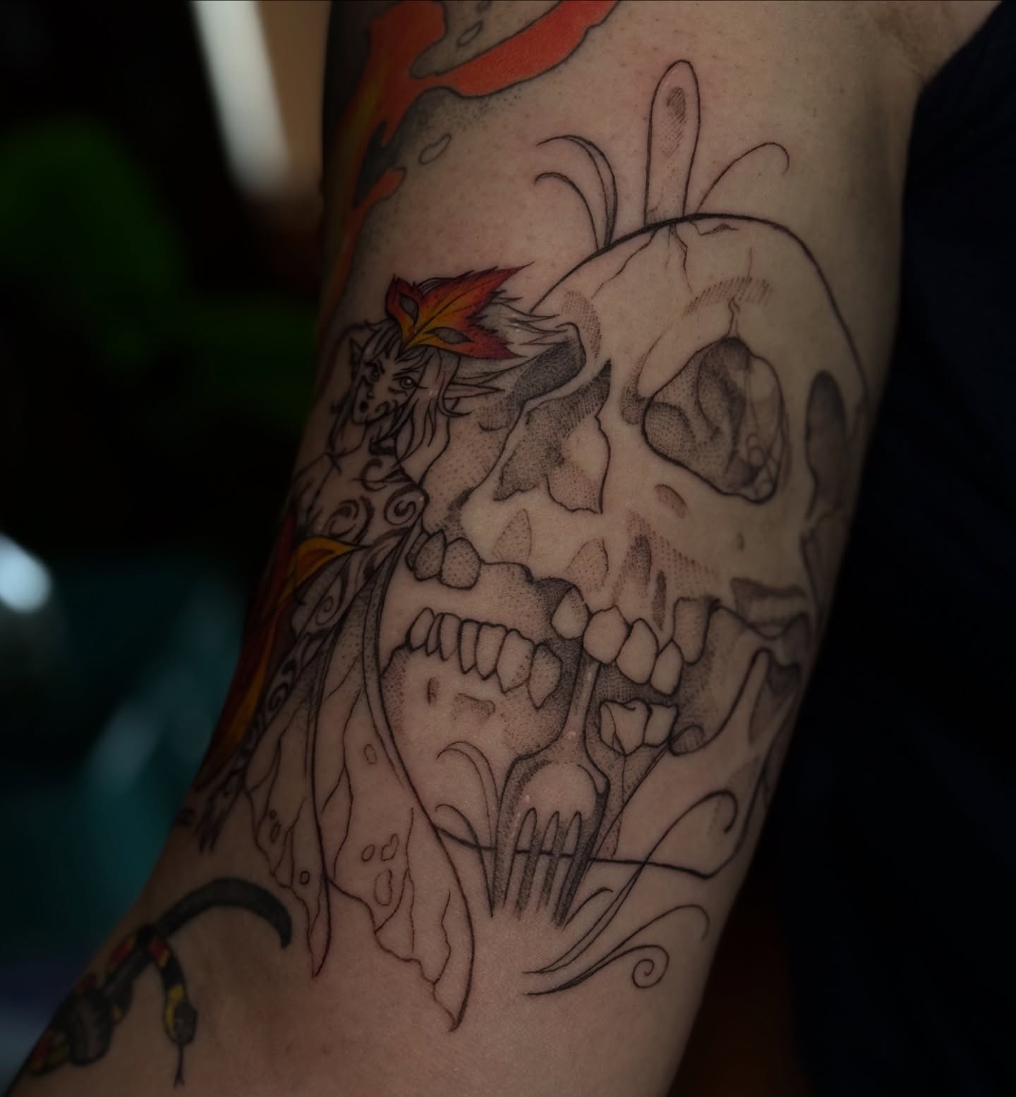 Skull with flame realism tattoo on the forearm by Jynx