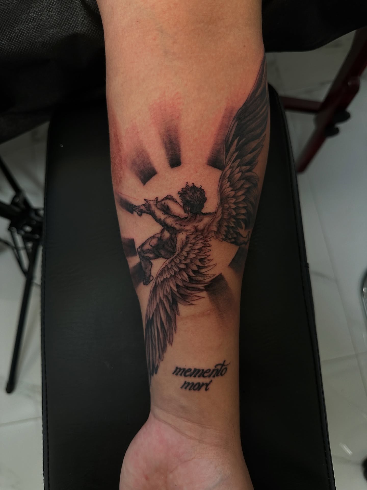 Angel with sword black and grey tattoo on the forearm by Dennis Alejandro
