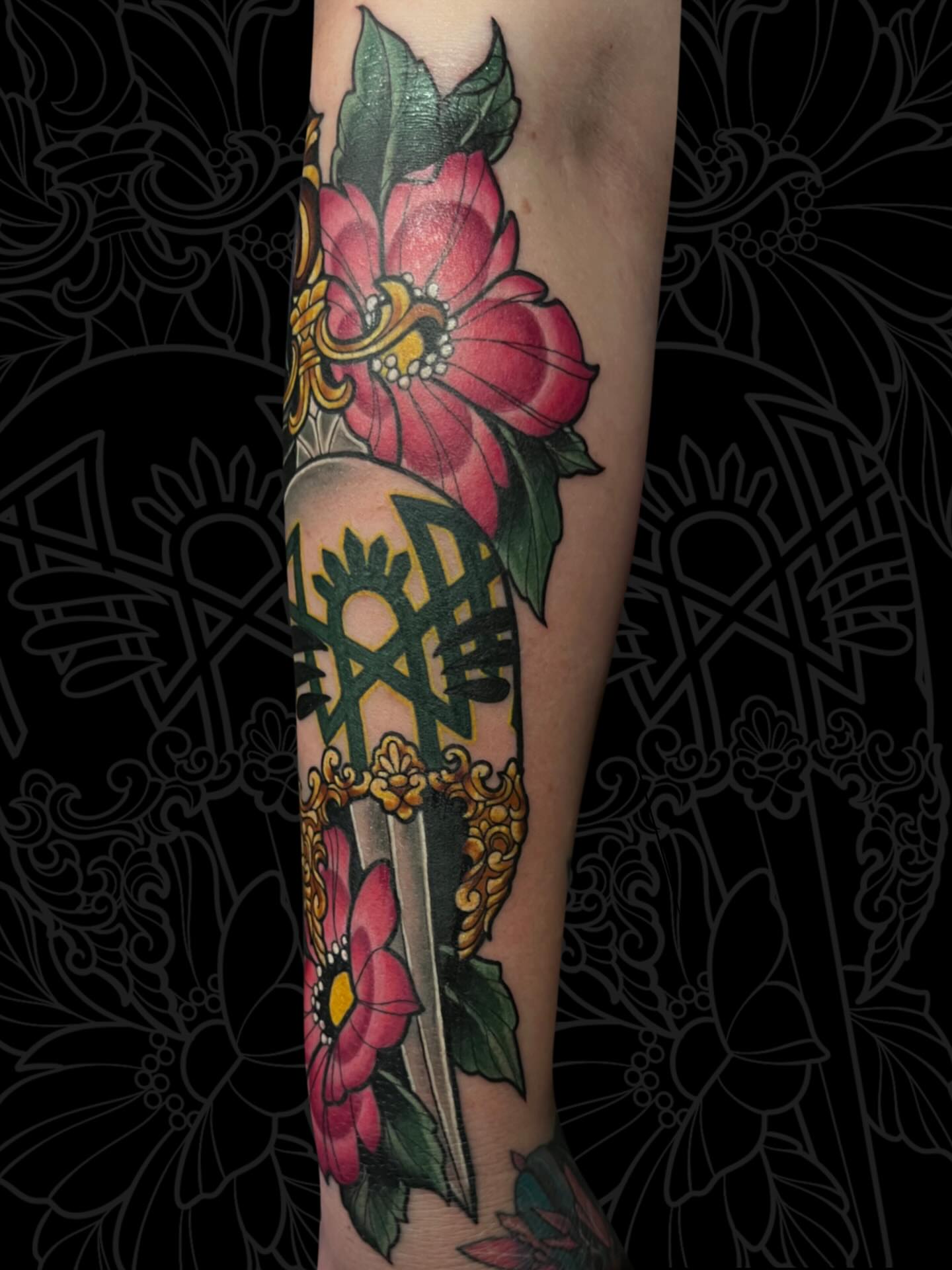 Floral dagger American traditional tattoo on the forearm by Olivia Whan Tattoos🌙