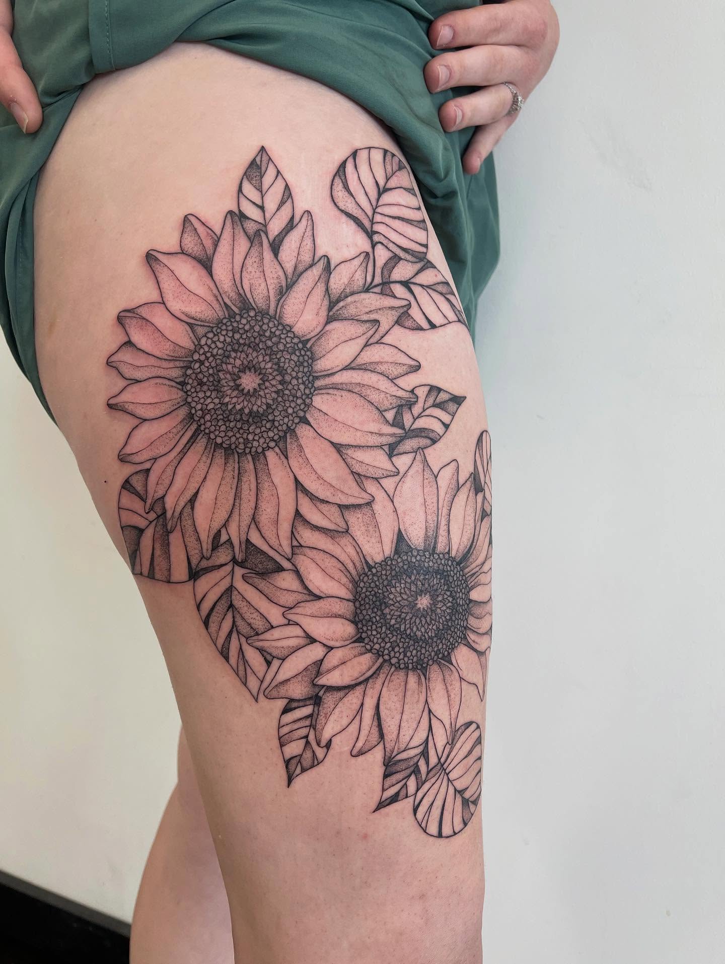 Sunflowers dotwork tattoo on the thigh by Miesha Busker