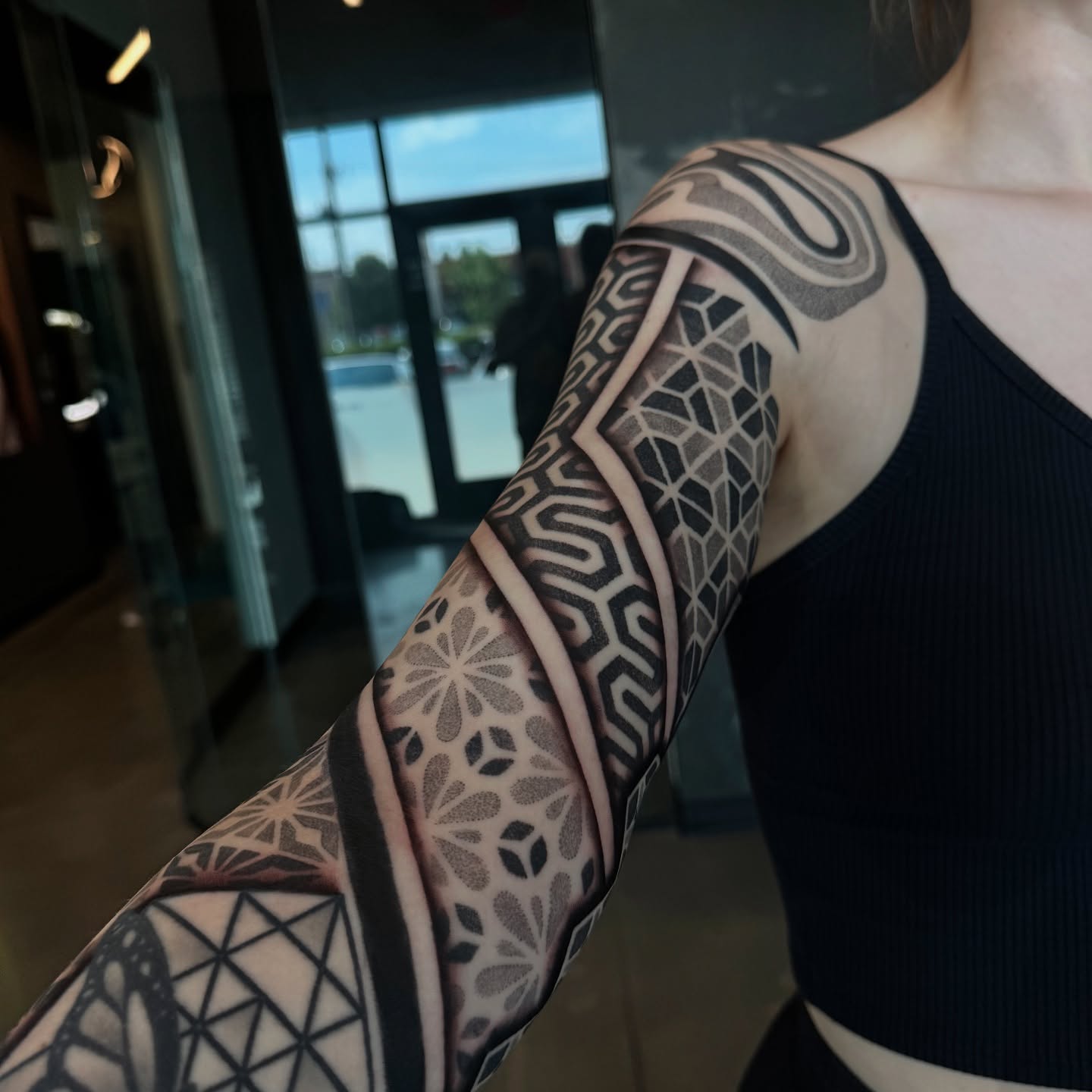 Geometric patterns geometric tattoo on the upper arm by Christofer Irvin