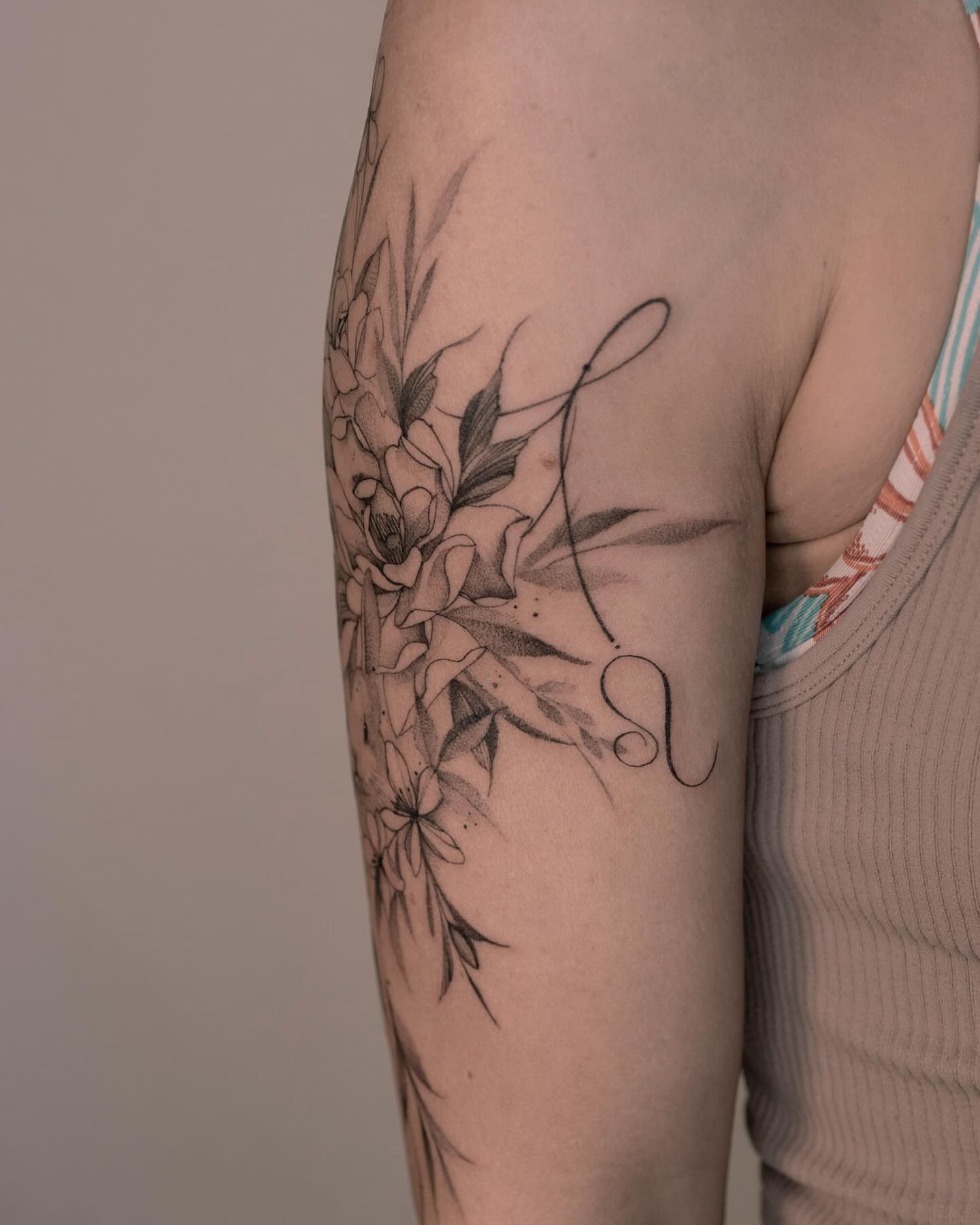 Floral bouquet black and grey tattoo on the forearm by Tattooist hea