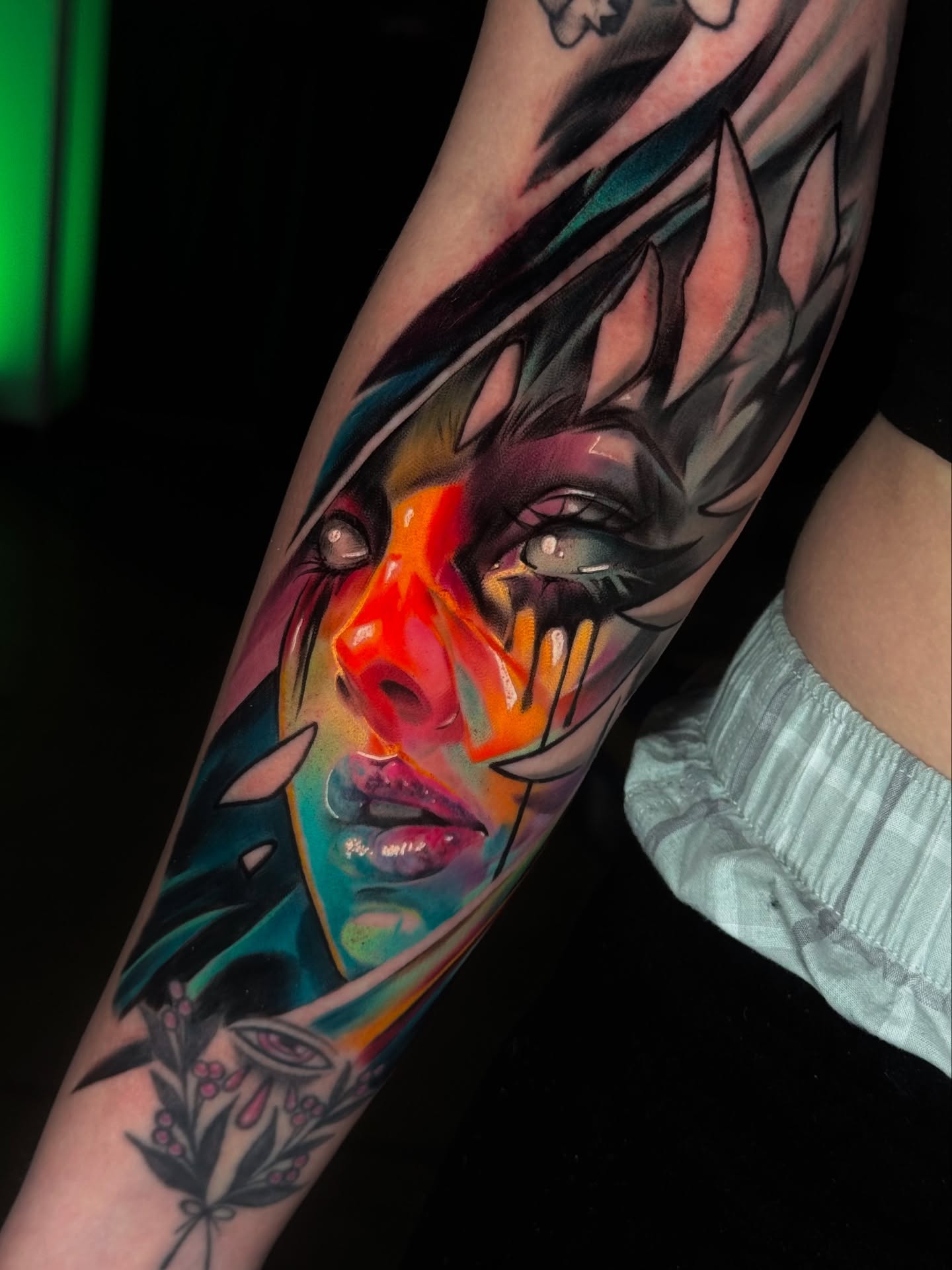 Abstract face illustrative tattoo on the forearm by Juan Pablo Molina