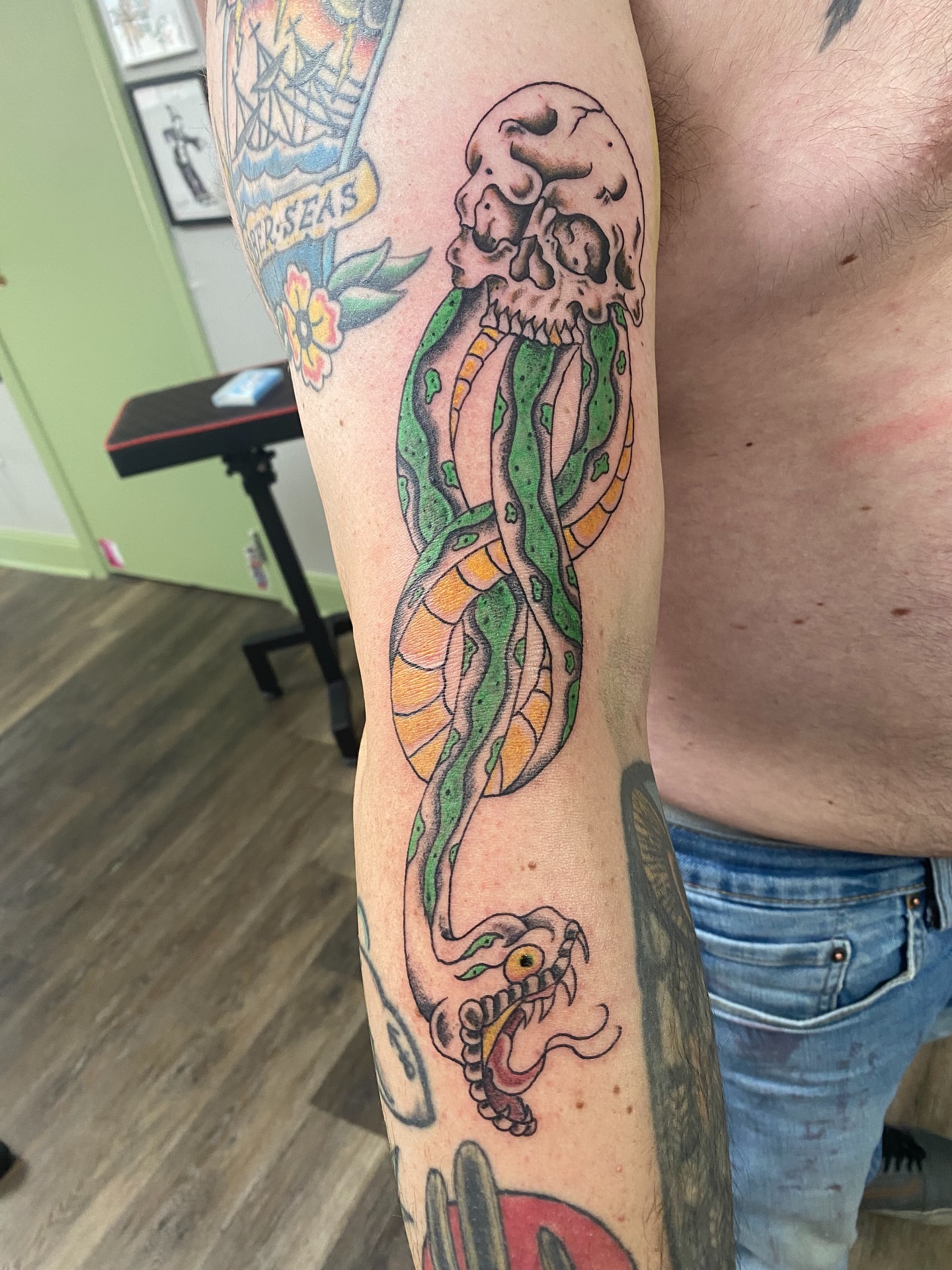 Snake and skull American traditional tattoo on the forearm by Giuseppe T.C.