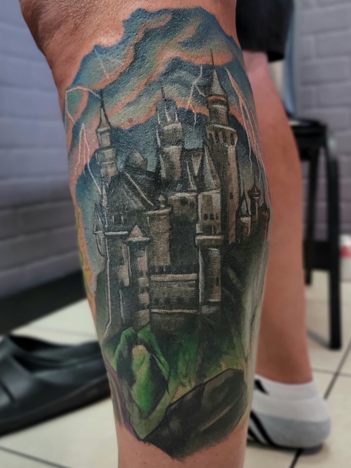 Castle realism tattoo on the calf by Lizz Zonno, Naperville, Illinois