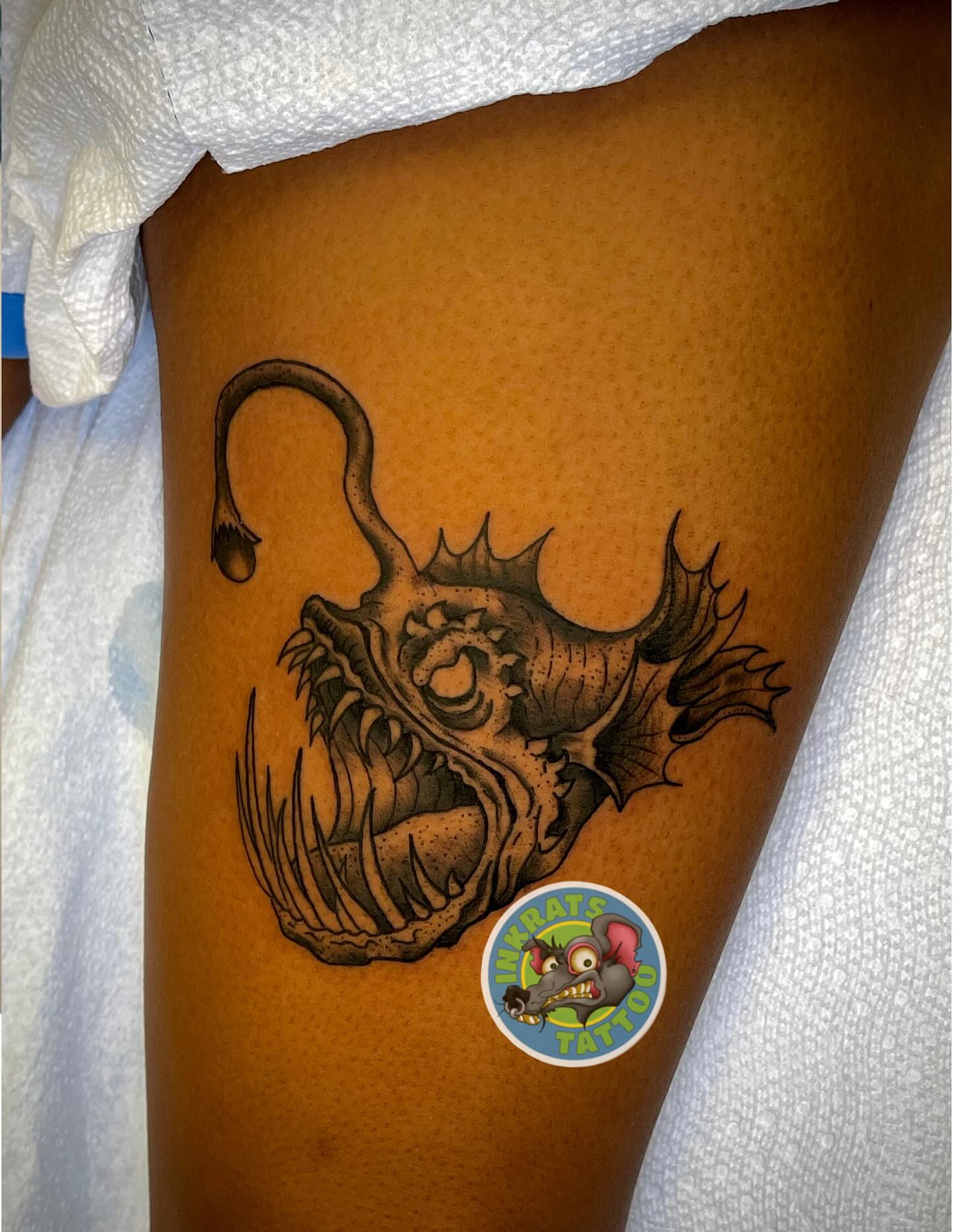 Fish black and grey tattoo on the thigh by Chadrick Gregory