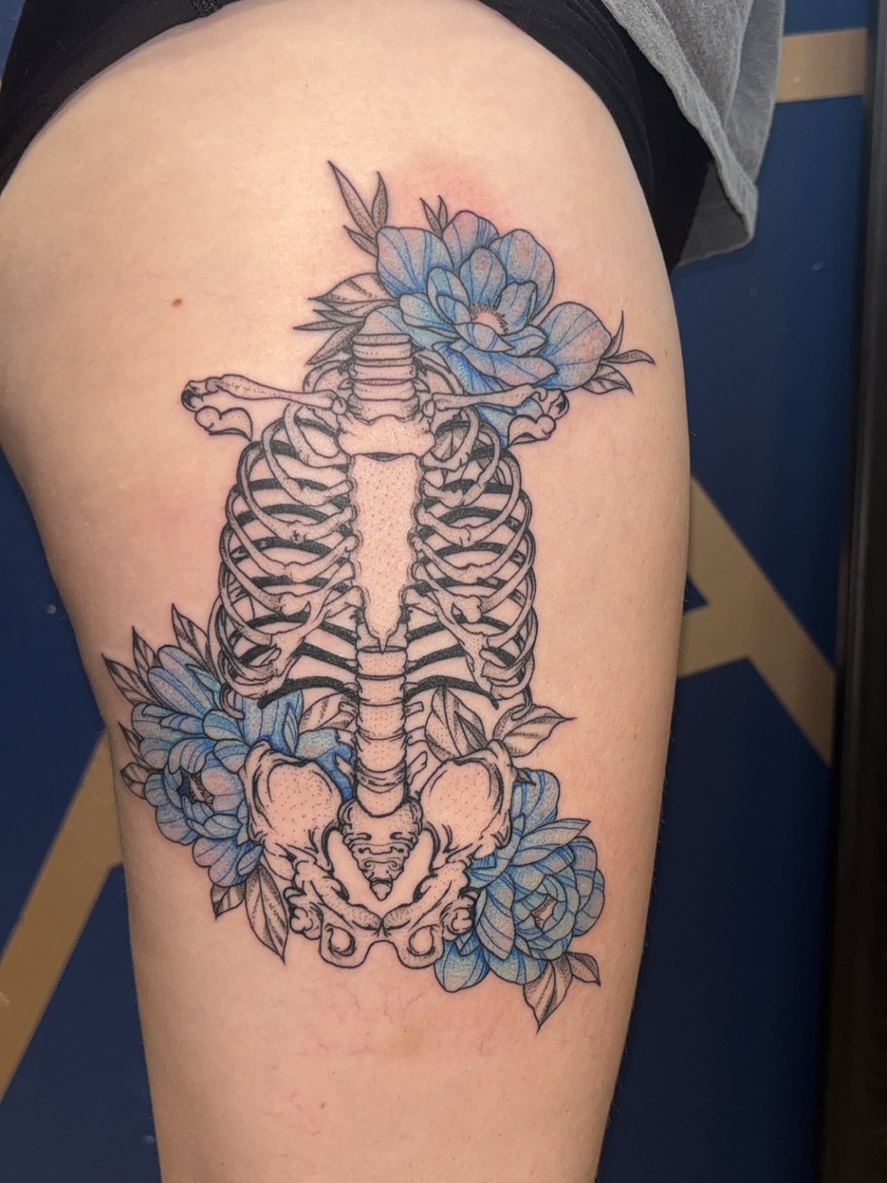 Ribcage with flowers neo-traditional tattoo on the thigh by ✨Cyerra Lynne✨