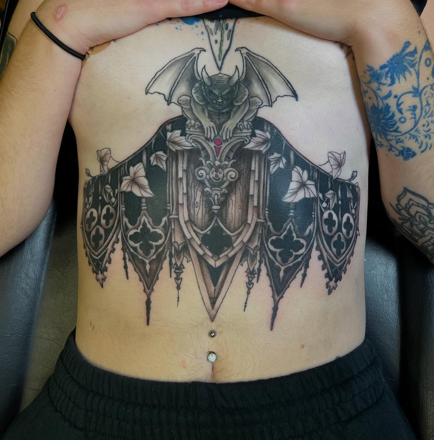 Gothic demon geometric tattoo on the torso by William “Shamrock” Sammon
