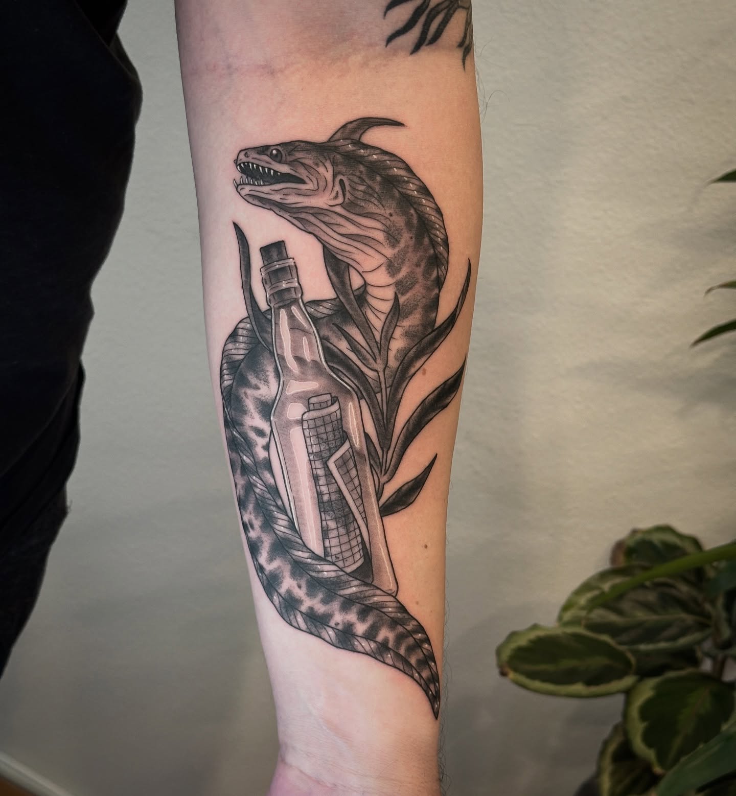 Snake and bottle realism tattoo on the forearm by Tattooing by Patty Valentine