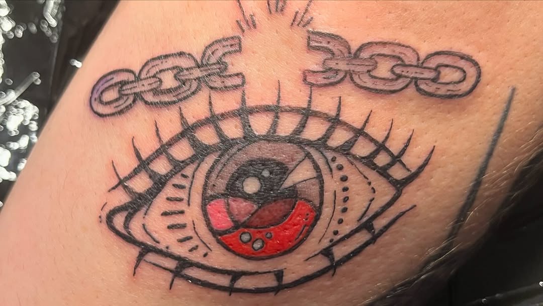 Eye and broken chain American traditional tattoo on the forearm by ❦julia