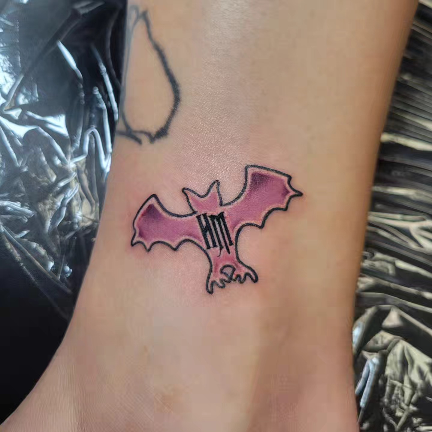 Bat geometric tattoo on the forearm by Marina Cobb