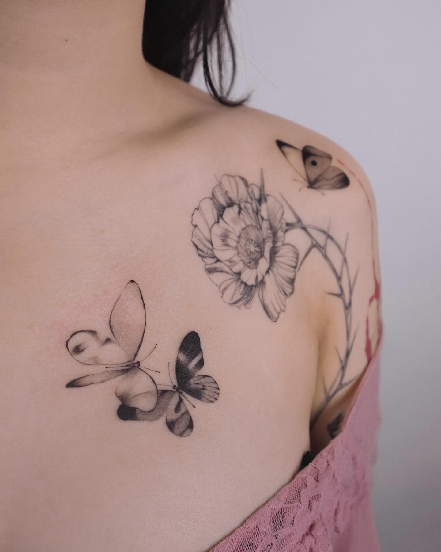 Butterflies and flower realism tattoo on the shoulder by River, New York, New York