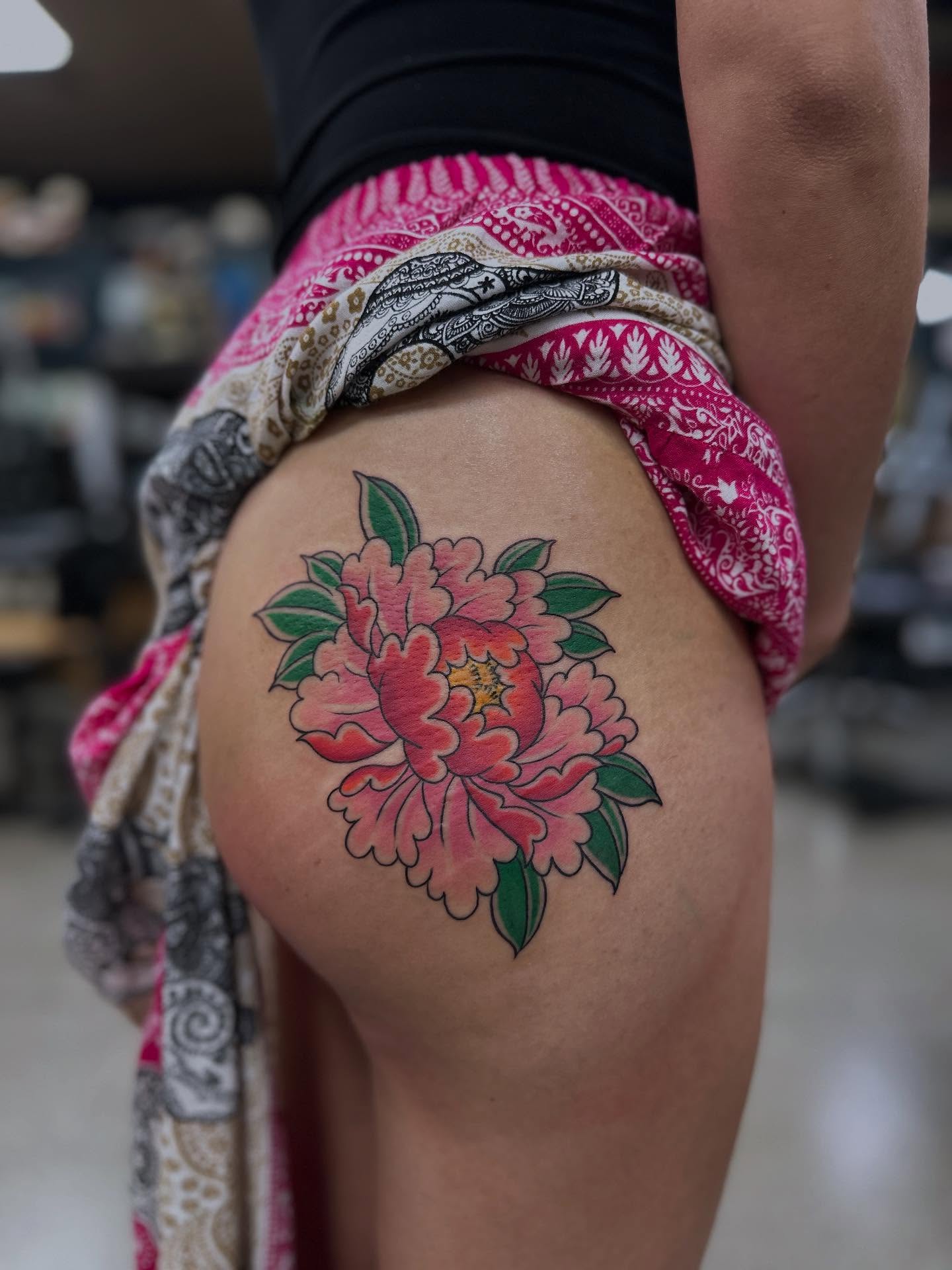 Peony American traditional tattoo on the thigh by Shawn Feng