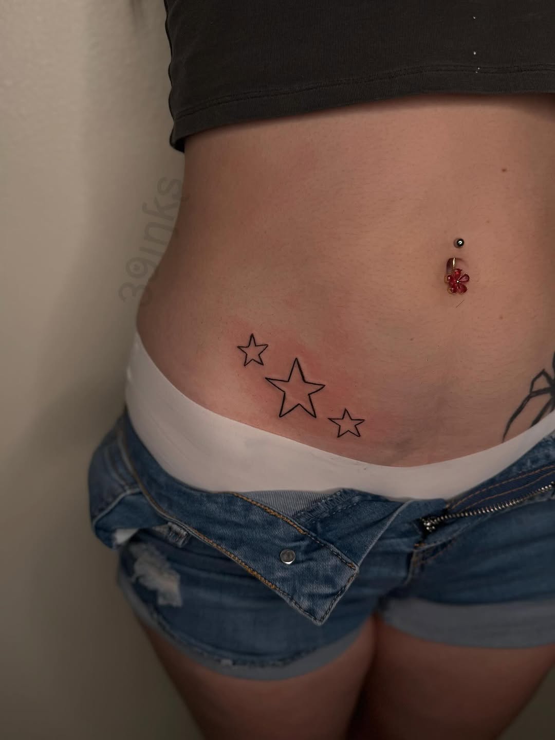 Three stars lettering tattoo on the torso by Juliette :D