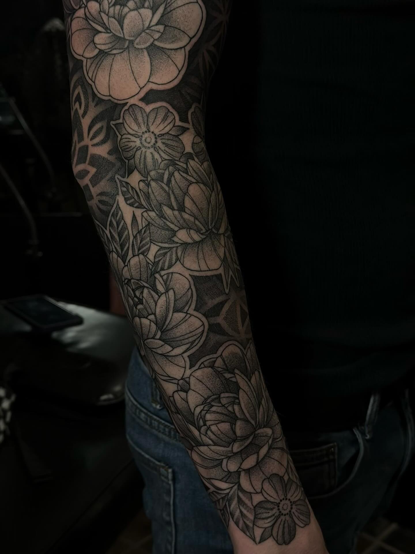 Floral bouquet black and grey tattoo on the forearm by Jesse (Dreadzilla)