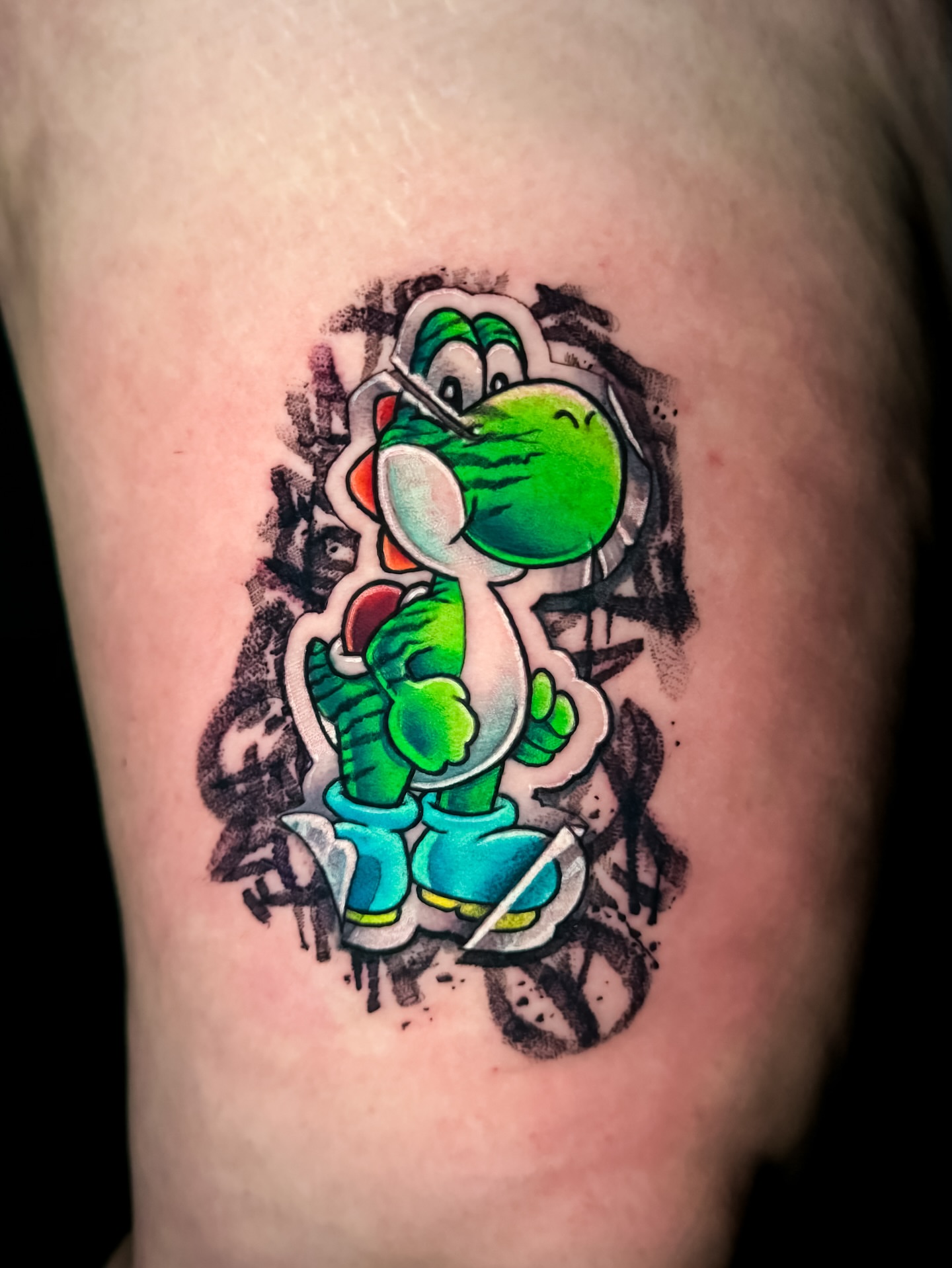 Yoshi new school tattoo on the thigh by Tattoo artist in Seattle, WA