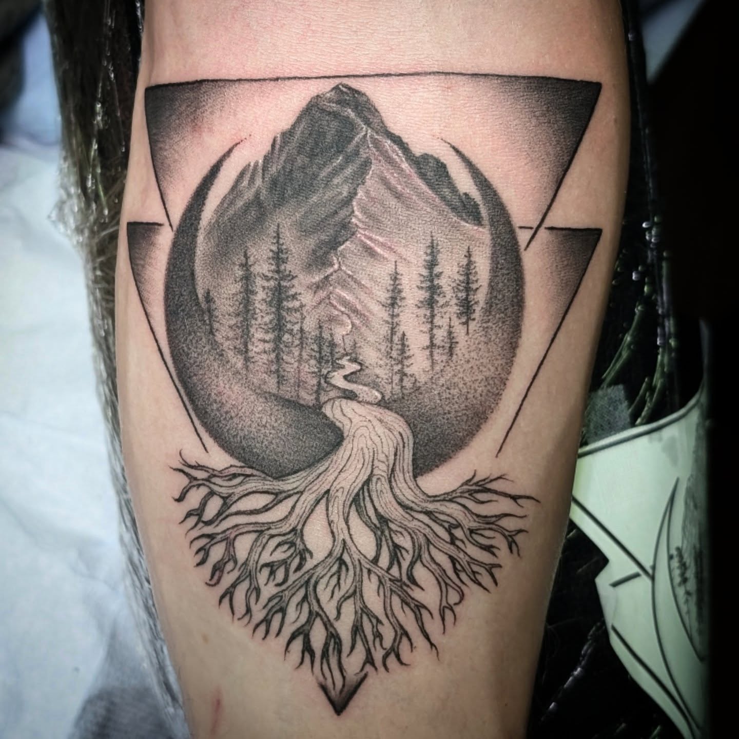 Mountain landscape dotwork tattoo on the thigh by Krista Mc