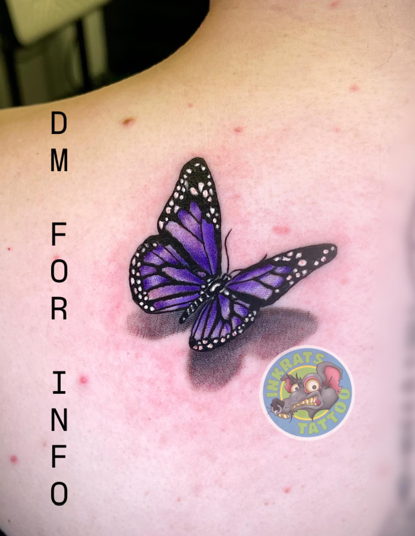 Purple butterfly dotwork tattoo on the back by Chadrick Gregory