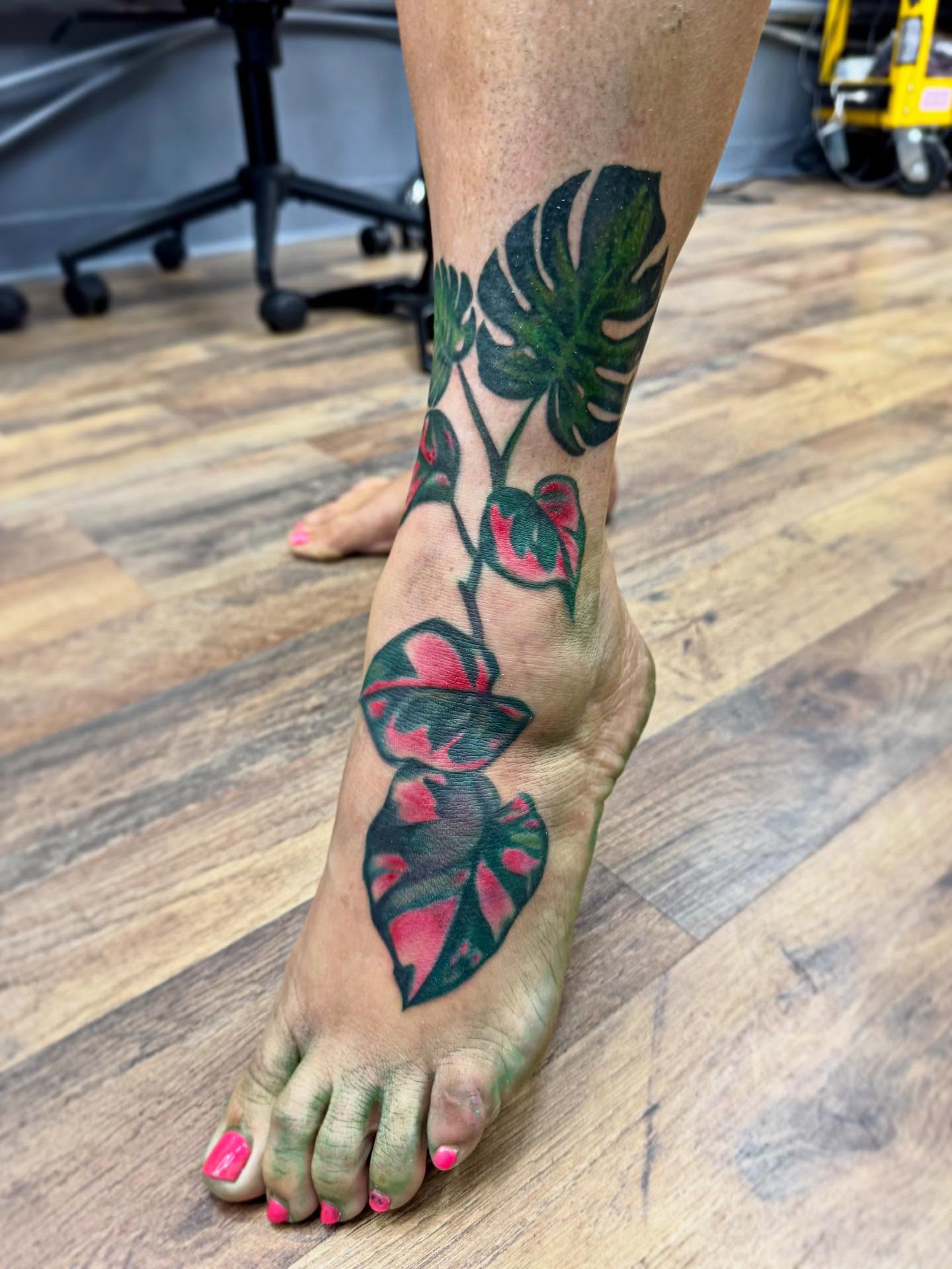 Monstera leaves realism tattoo on the foot by Waylen Foster