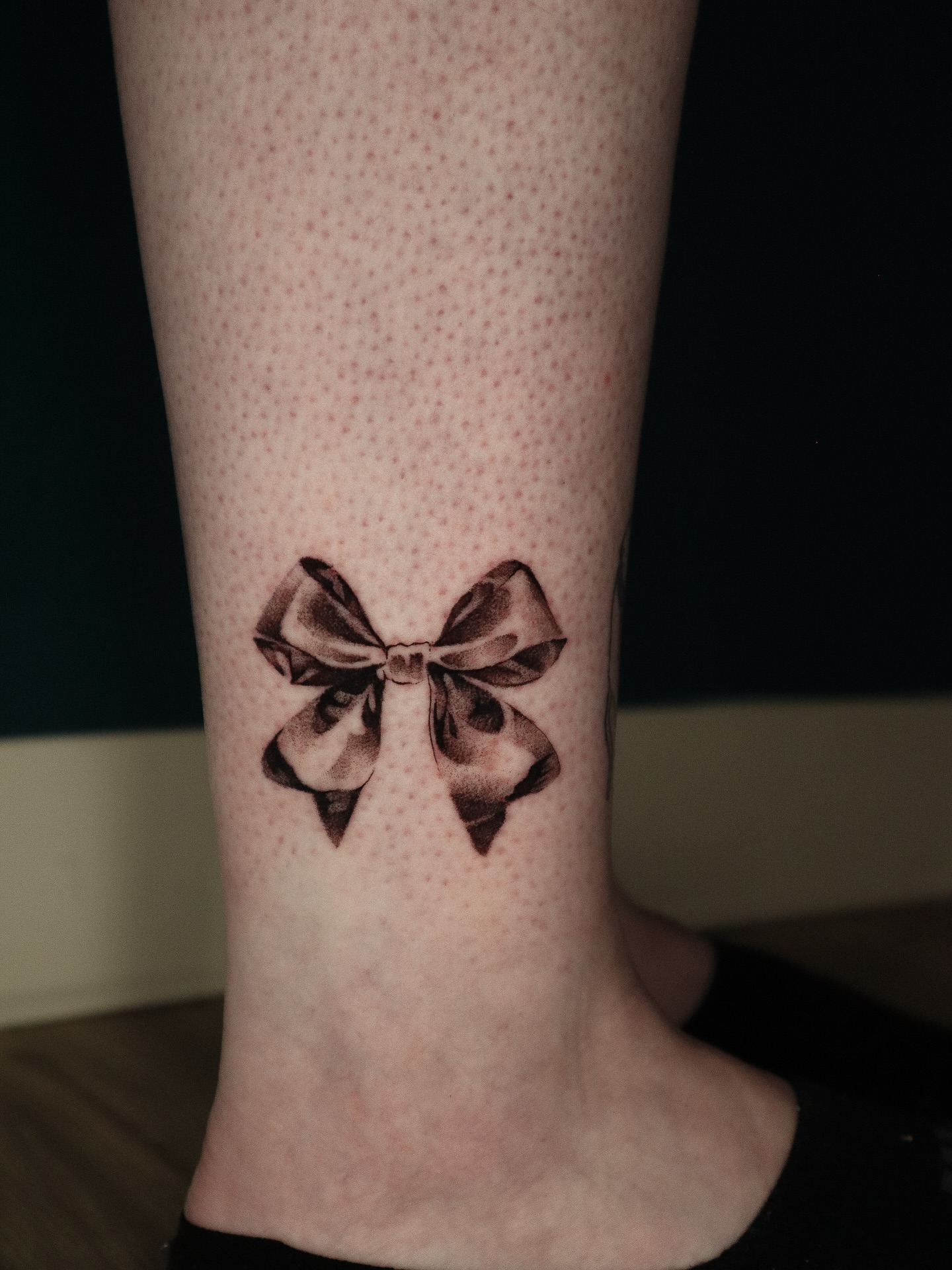 Bow dotwork tattoo on the calf by 𝕮𝖔𝖓𝖓𝖔𝖗 ☾  ~ TATTOO ARTIST