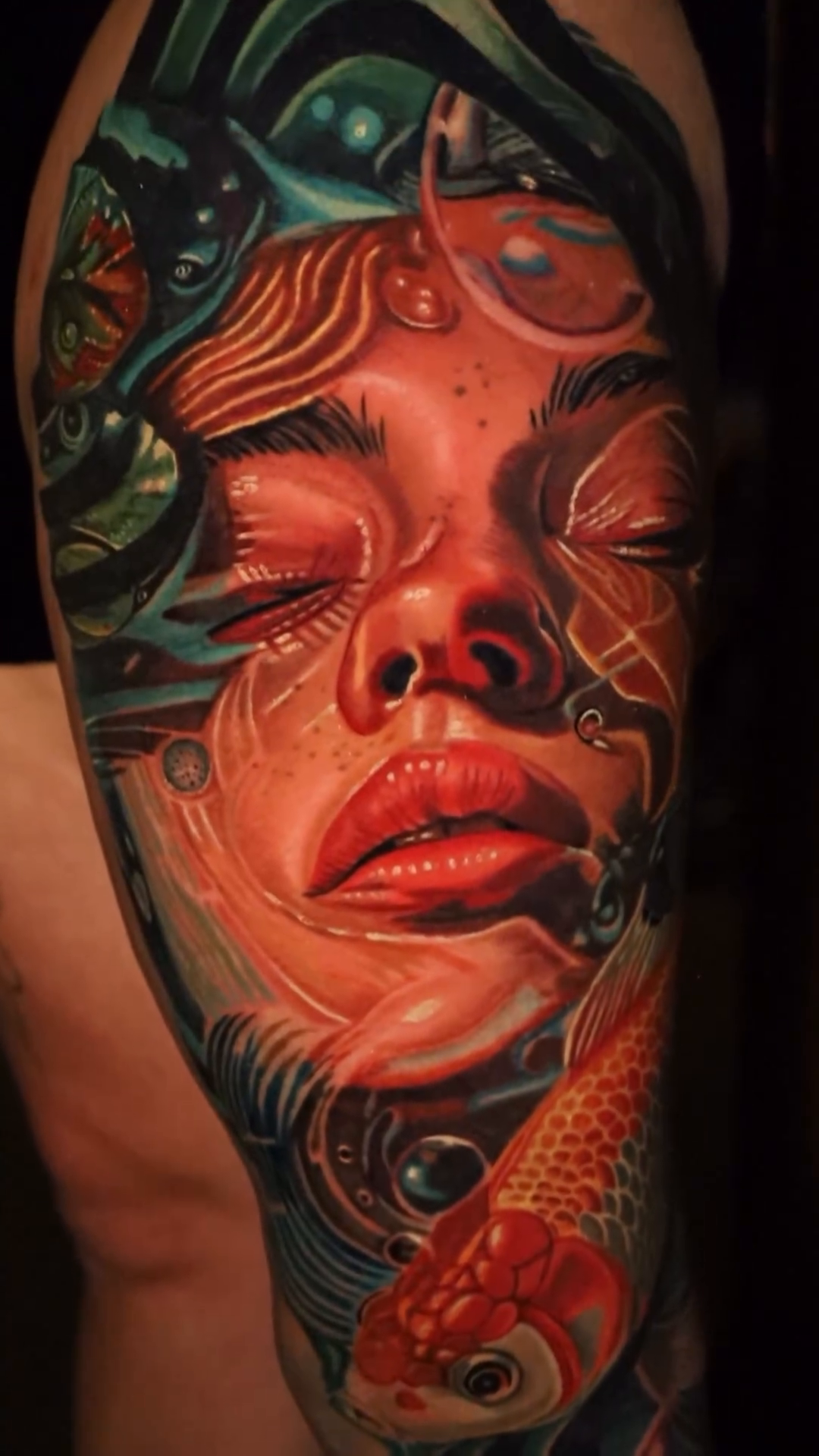 Woman and koi fish realism tattoo by Bryan Palacios