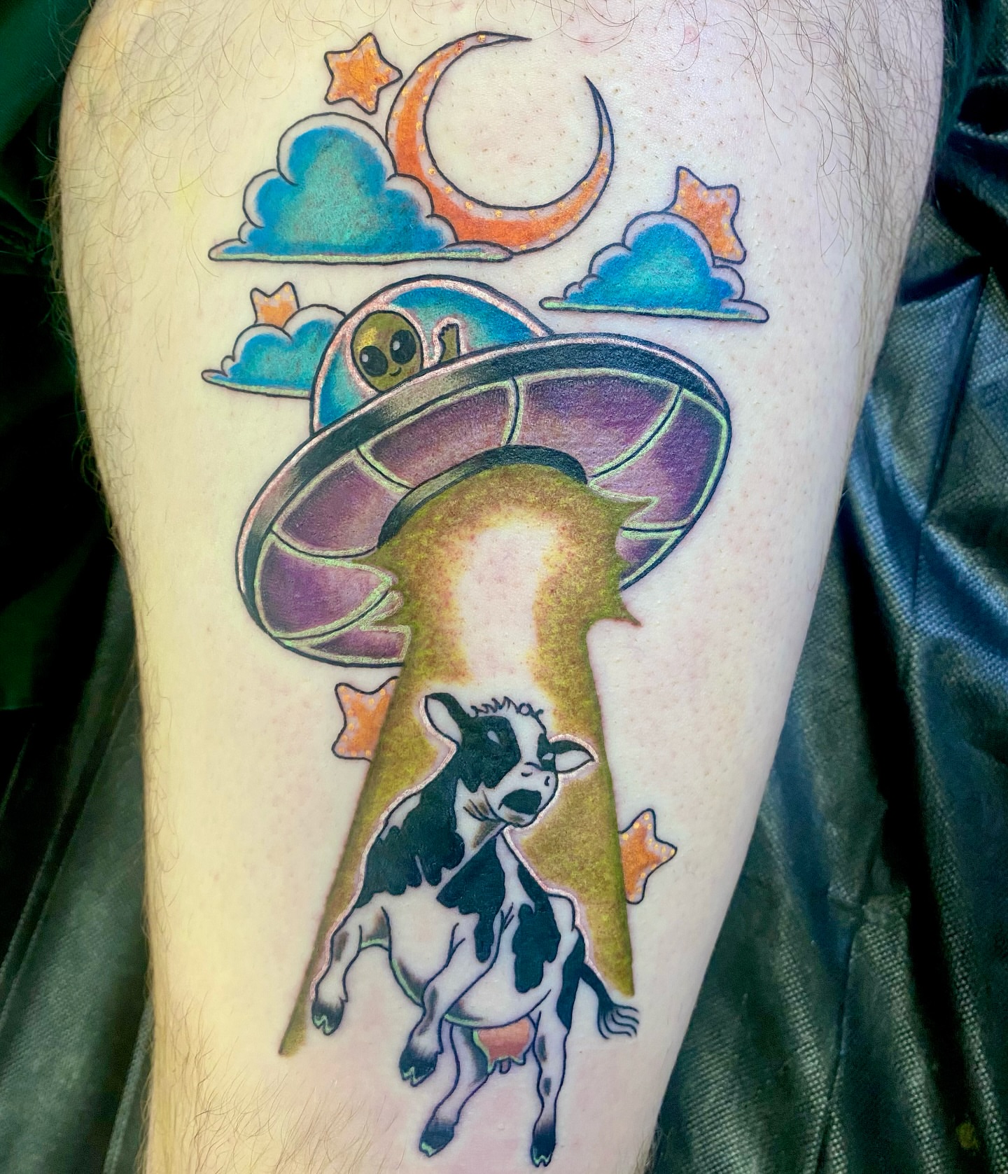 Cow abduction illustrative tattoo on the forearm by Ashley Lin Las Vegas Tattoo Artist